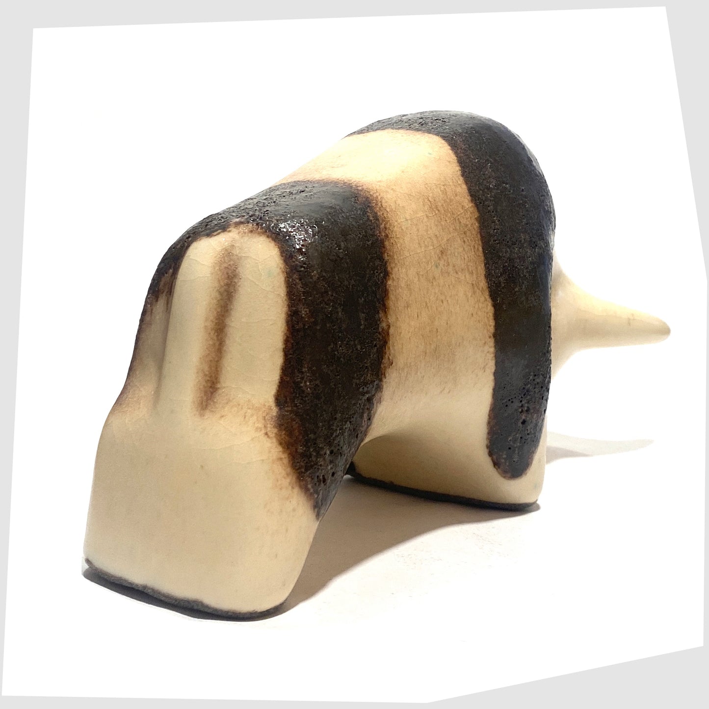 rear of the Otto Keramik Bull in natural glaze with bands of dark brown fat lava