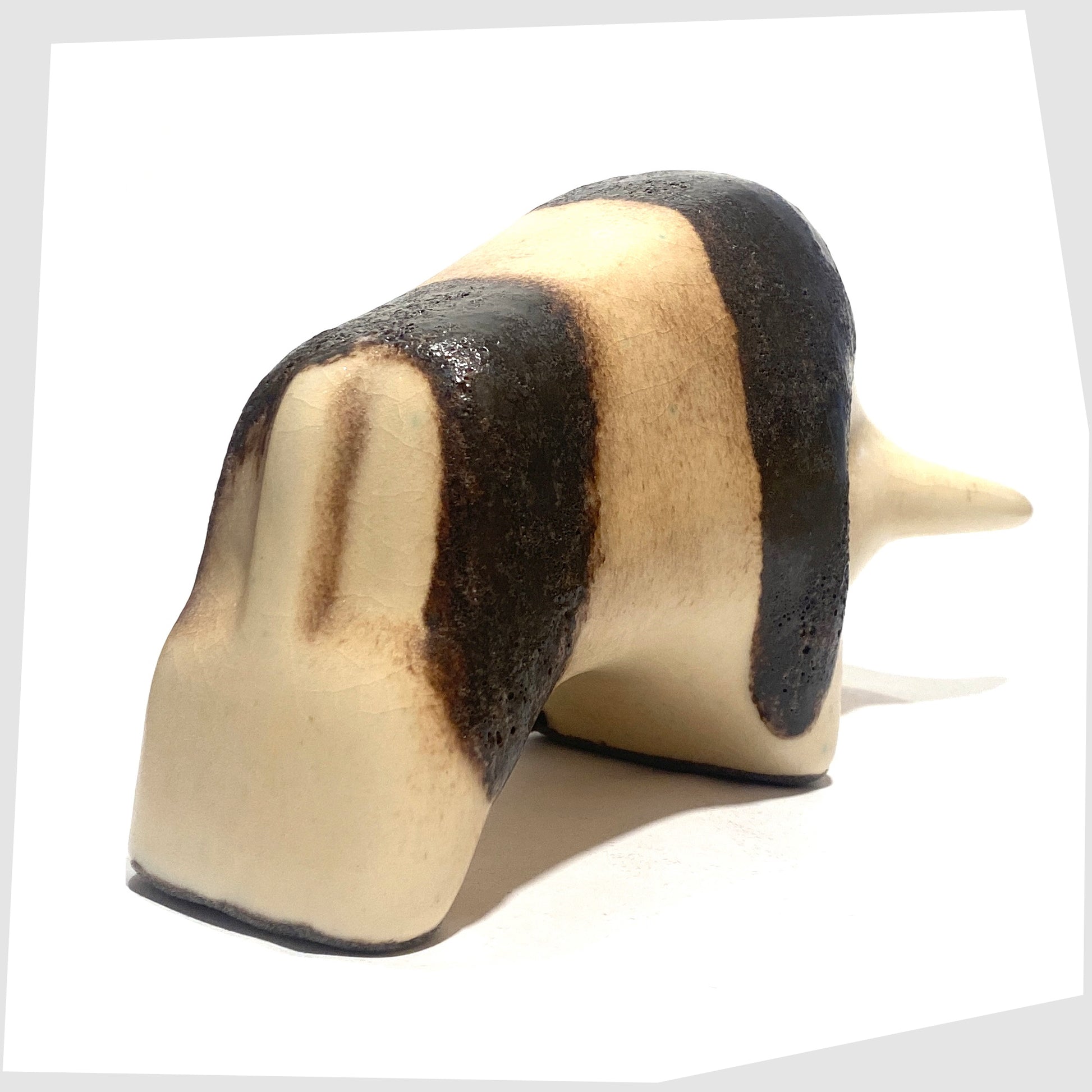 rear of the Otto Keramik Bull in natural glaze with bands of dark brown fat lava