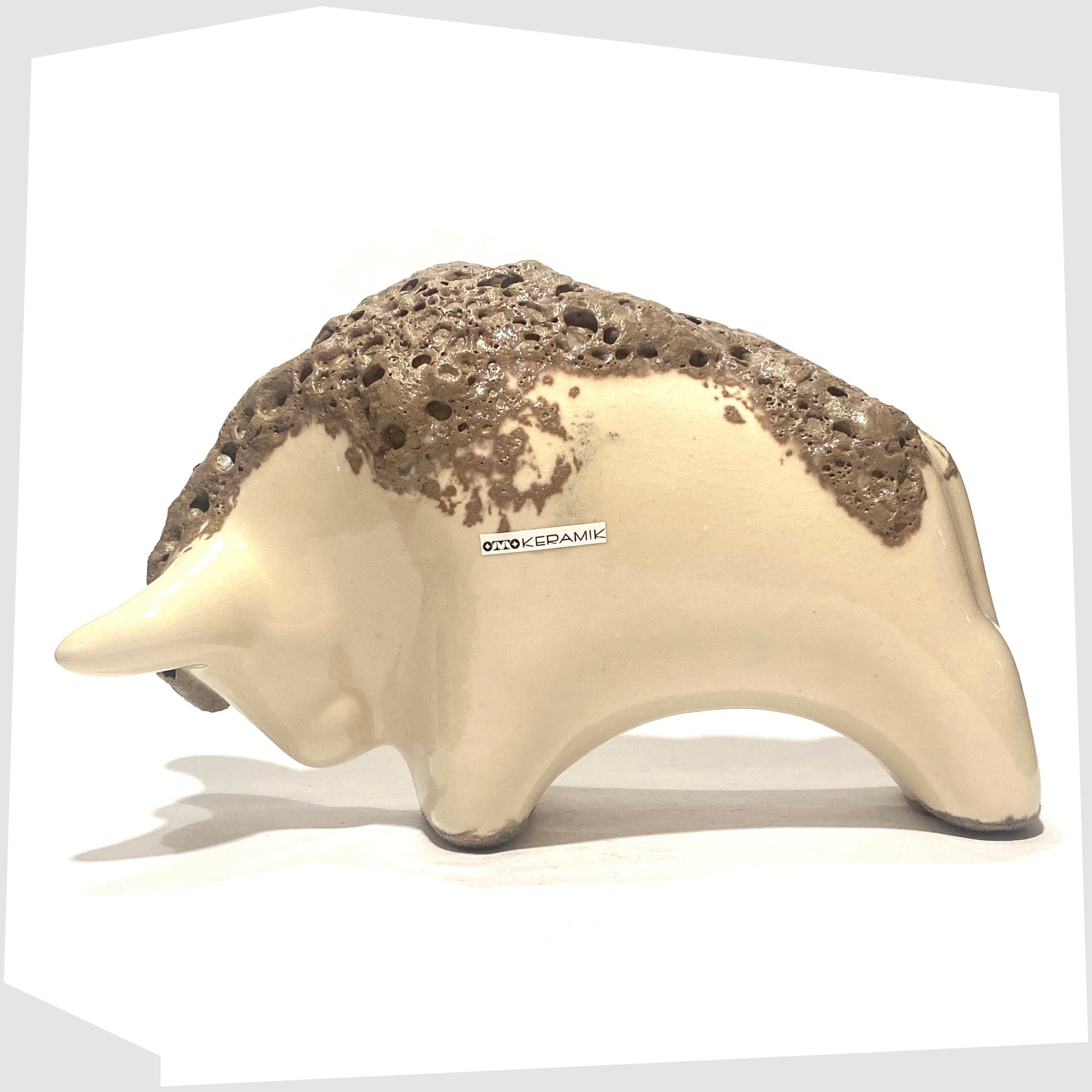 otto keramik bull in off-white glaze with brown fat lava along the spine