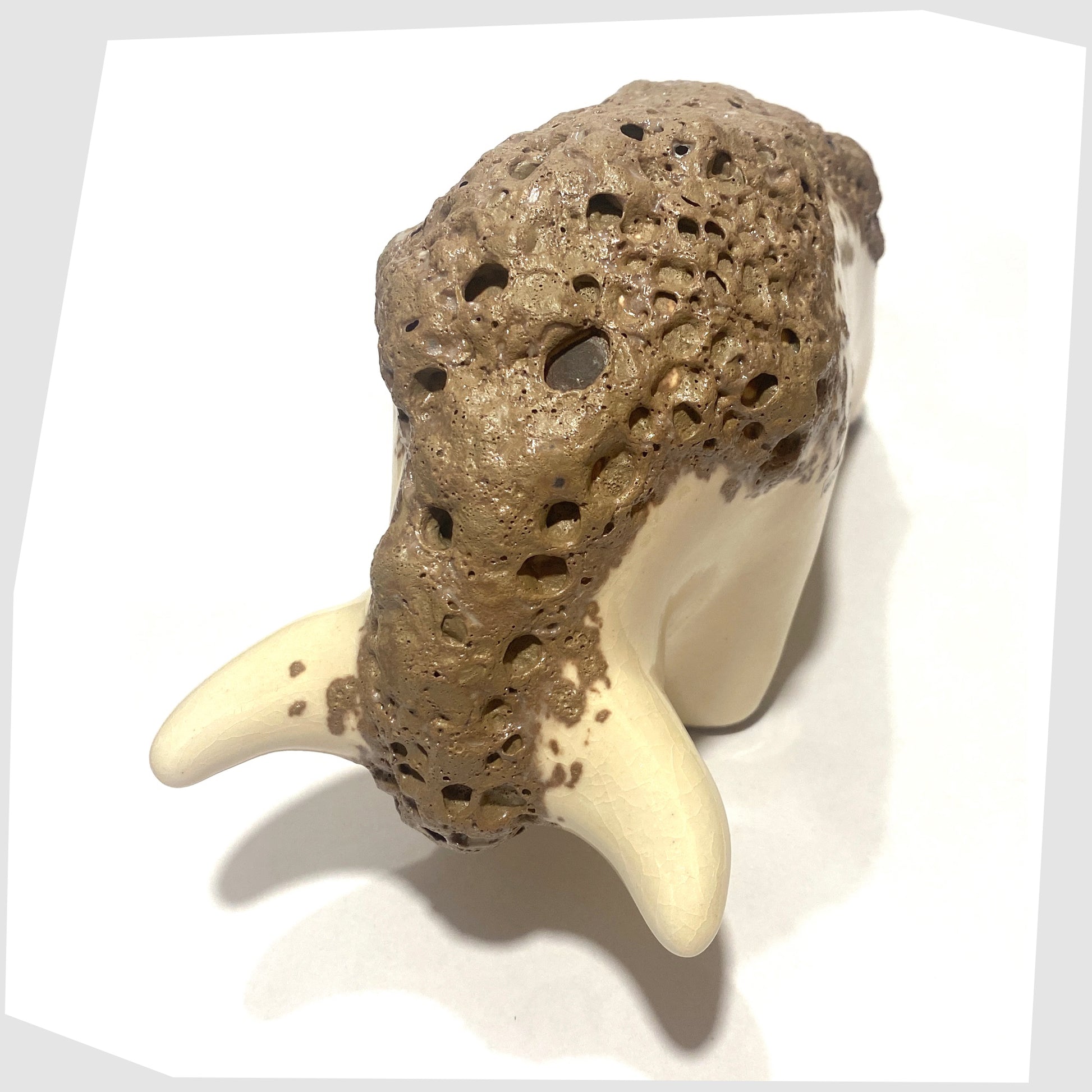 otto keramik ceramic bull sculpture in off-white glaze with brown fat lava along the spine