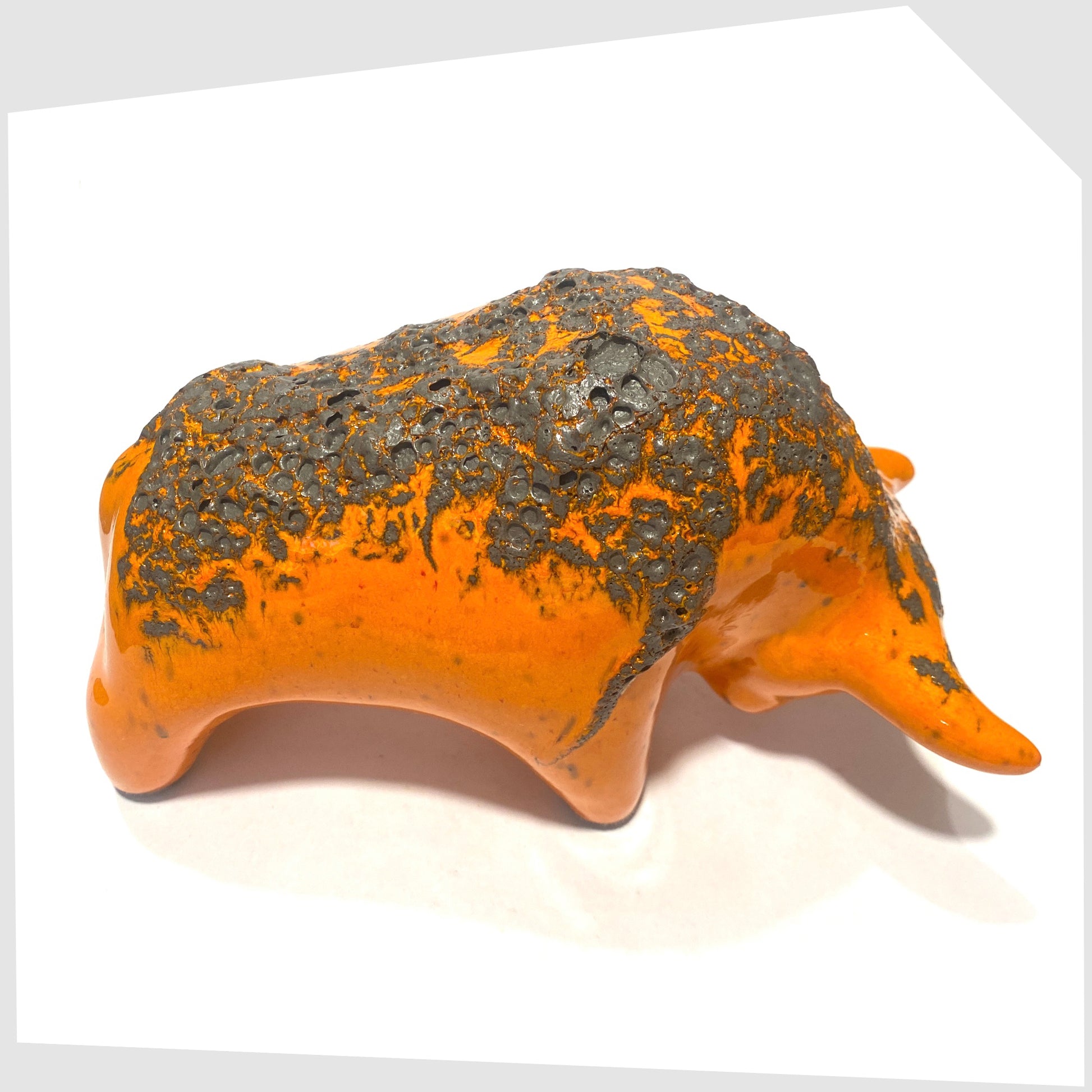 rear view of the Otto Keramik Bull in Orange Fat Lava showing the matte grey lava glaze on the orange gloss base