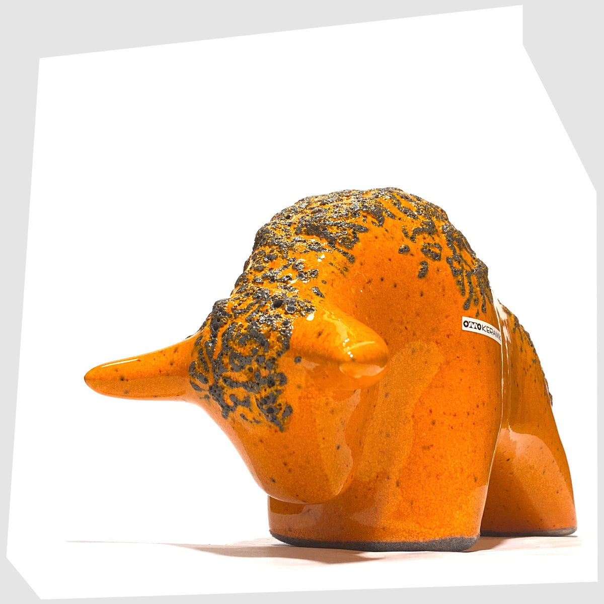 West German Pottery-style Otto Keramik Bull in Orange Fat Lava Glaze, shown on a white background