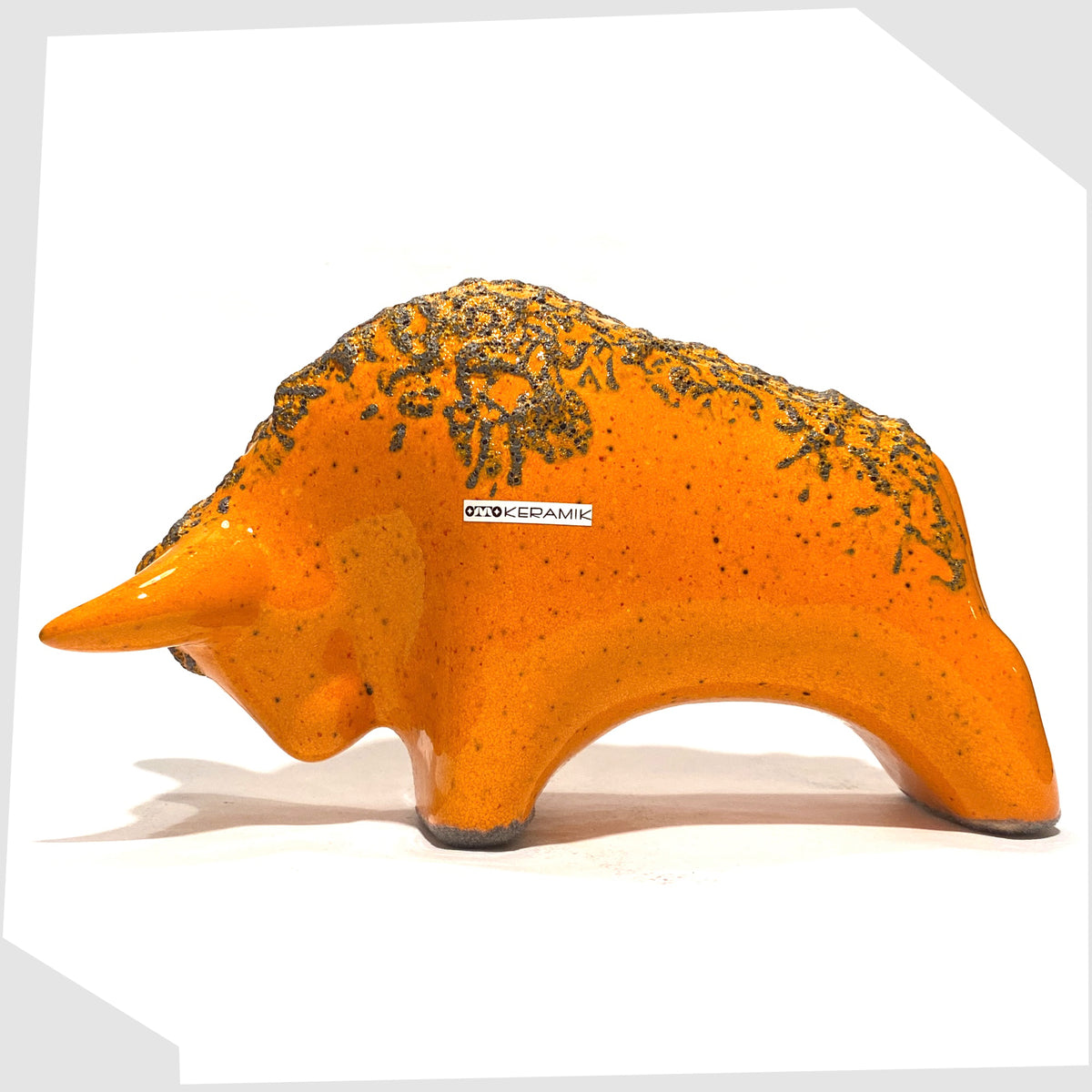 Otto Keramik Bull in Orange Fat Lava Glaze, shown on a white background
