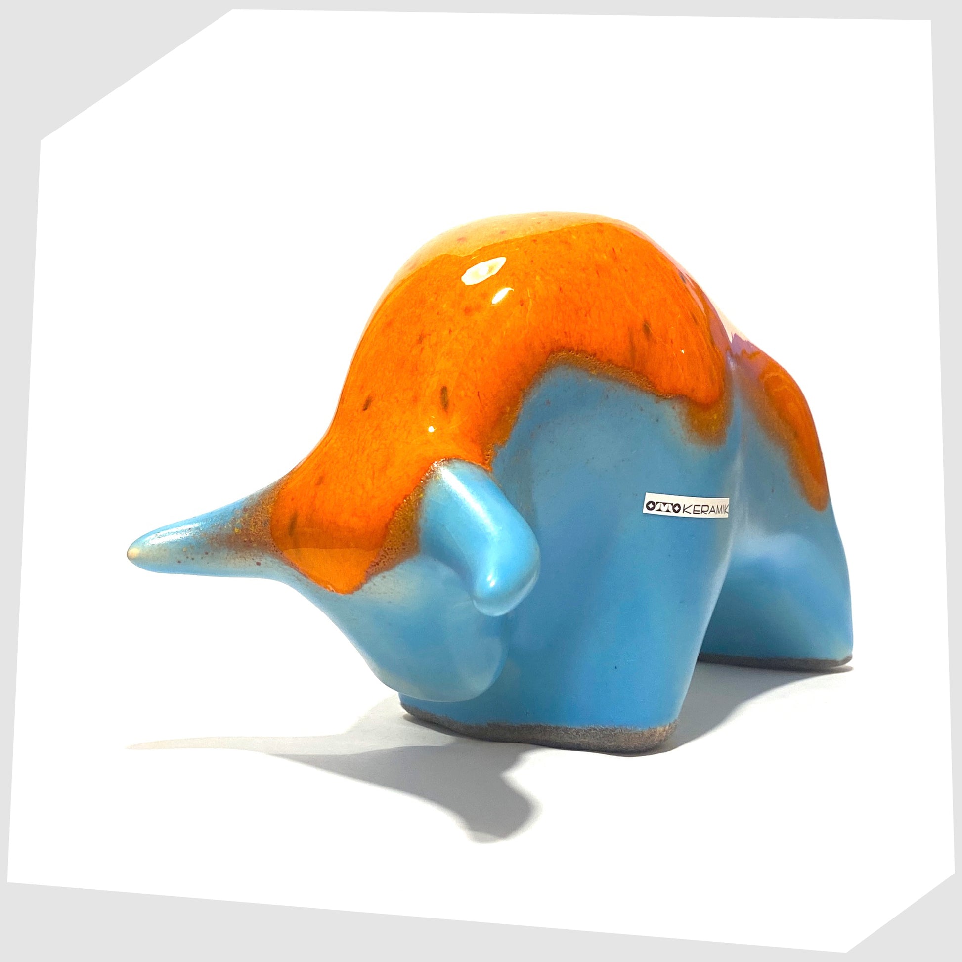 otto keramik pottery bull in orange drip glaze over a light blue base