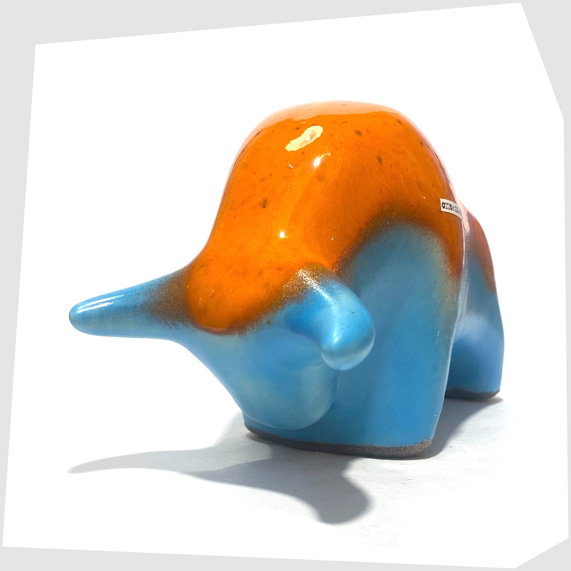 otto keramik pottery bull in orange drip glaze over a light blue base