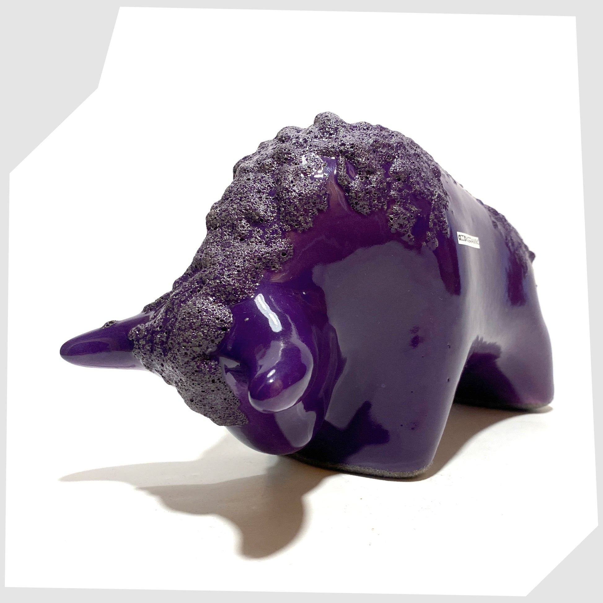 front horns of the Otto Keramik Bull in purple glaze with deep fat lava along the spine