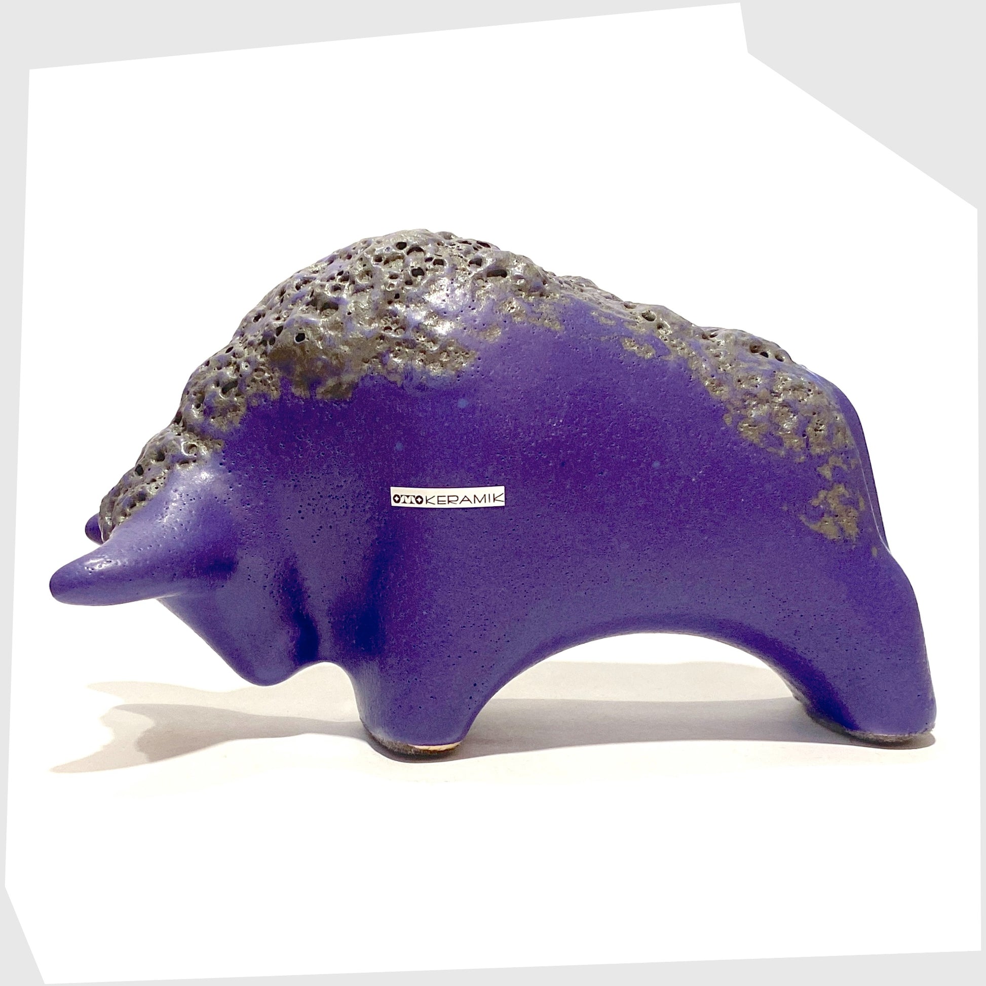 otto keramik ceramic bull in matte purple glaze with black fat lava along the spine