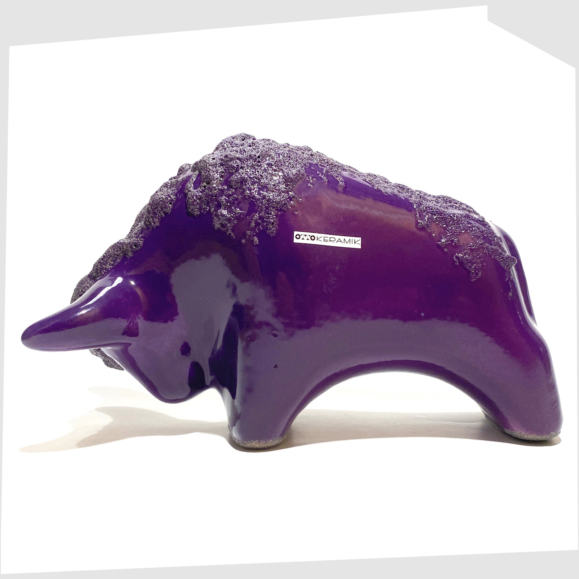 Otto Keramik Bull in purple glaze with deep fat lava along the spine