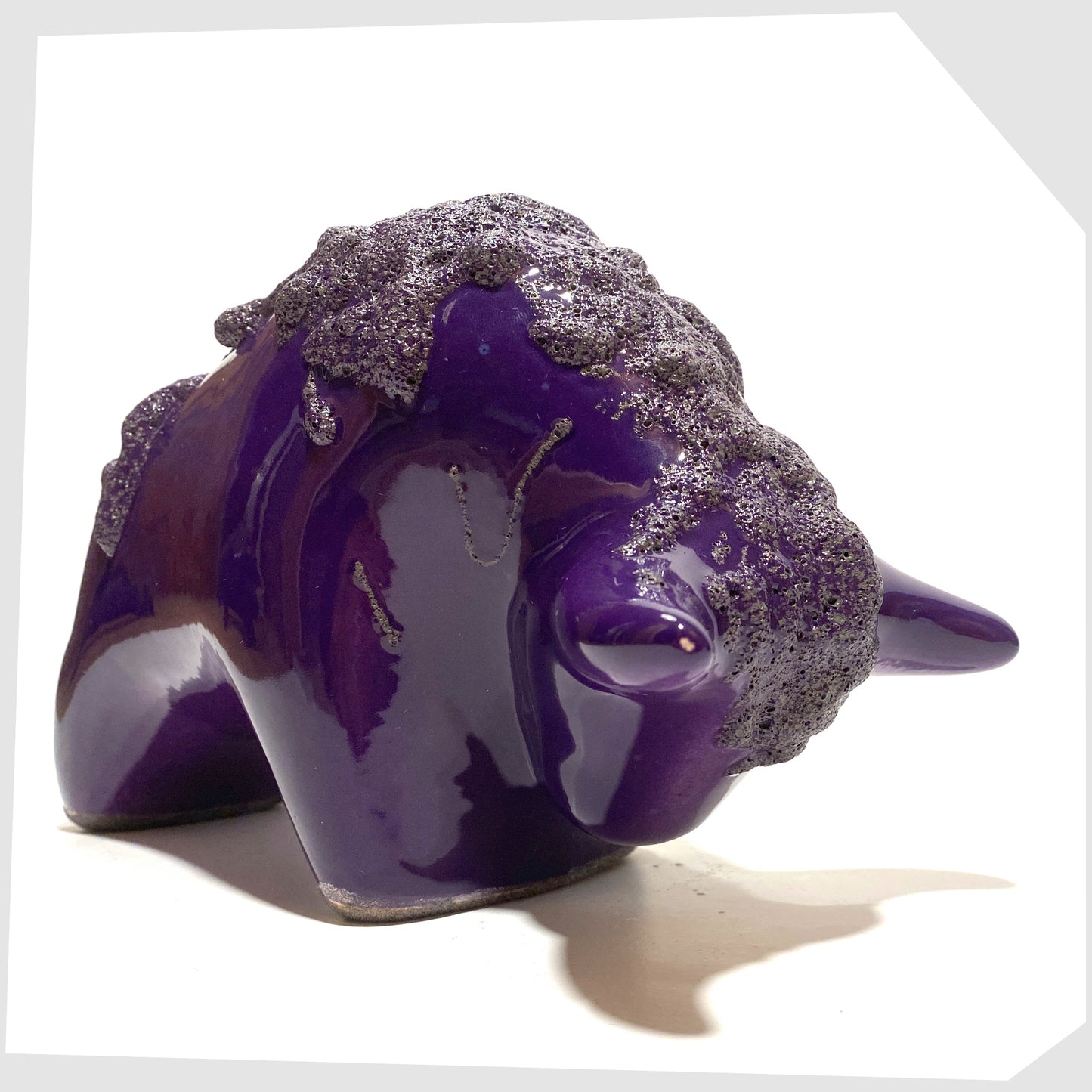 Front of the Otto Keramik Bull in purple glaze with deep fat lava along the spine