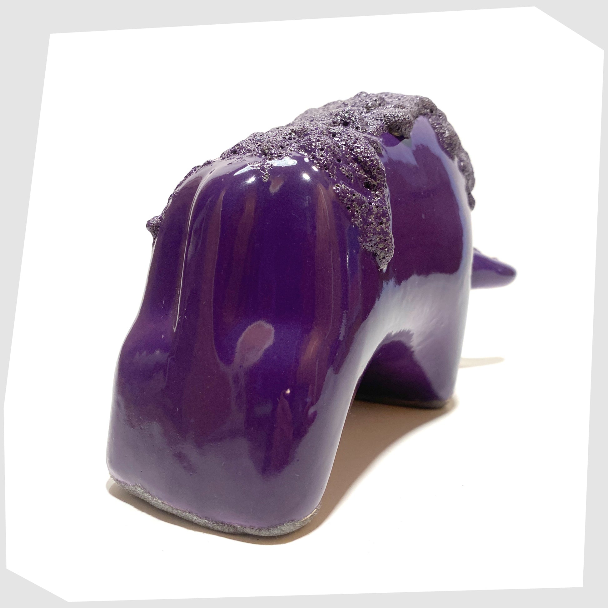 back of the Otto Keramik Bull in purple glaze with deep fat lava along the spine