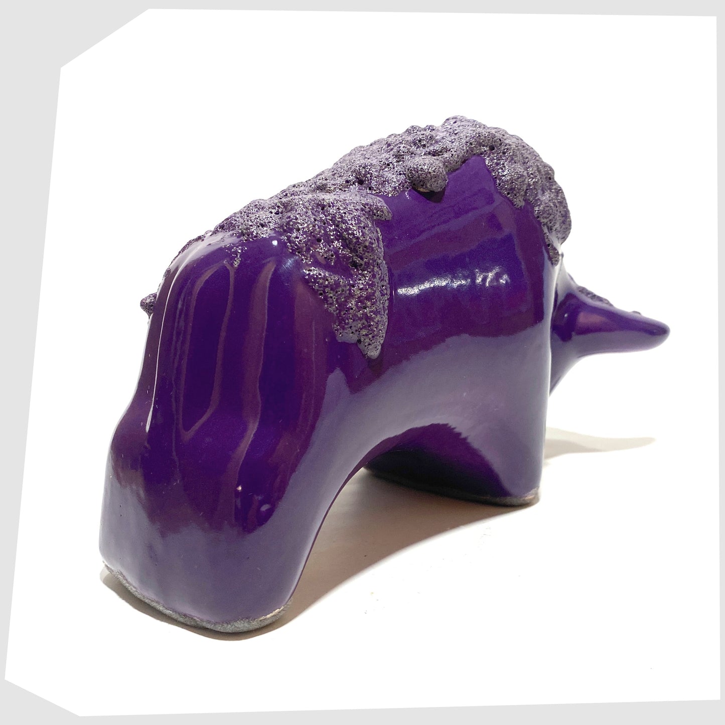 rear of the Otto Keramik Bull in purple glaze with deep fat lava along the spine