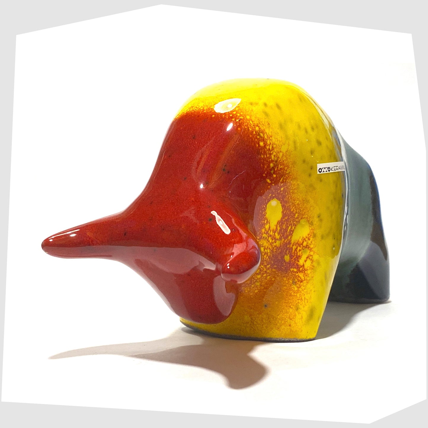front of the otto keramik ceramic bull shaped ornament in multicoloured rainbow glaze