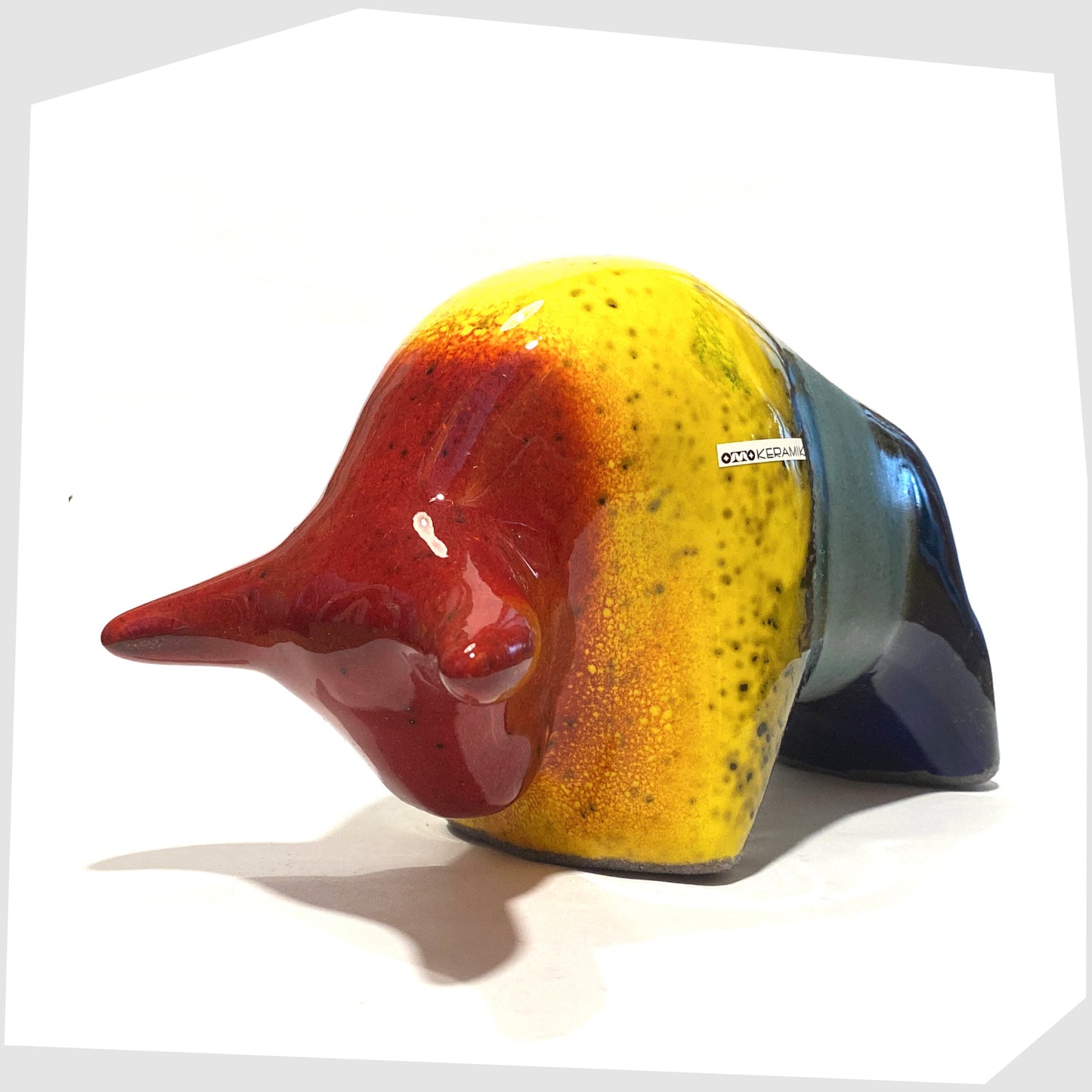 front of the otto keramik ceramic bull shaped ornament in multicoloured rainbow glaze