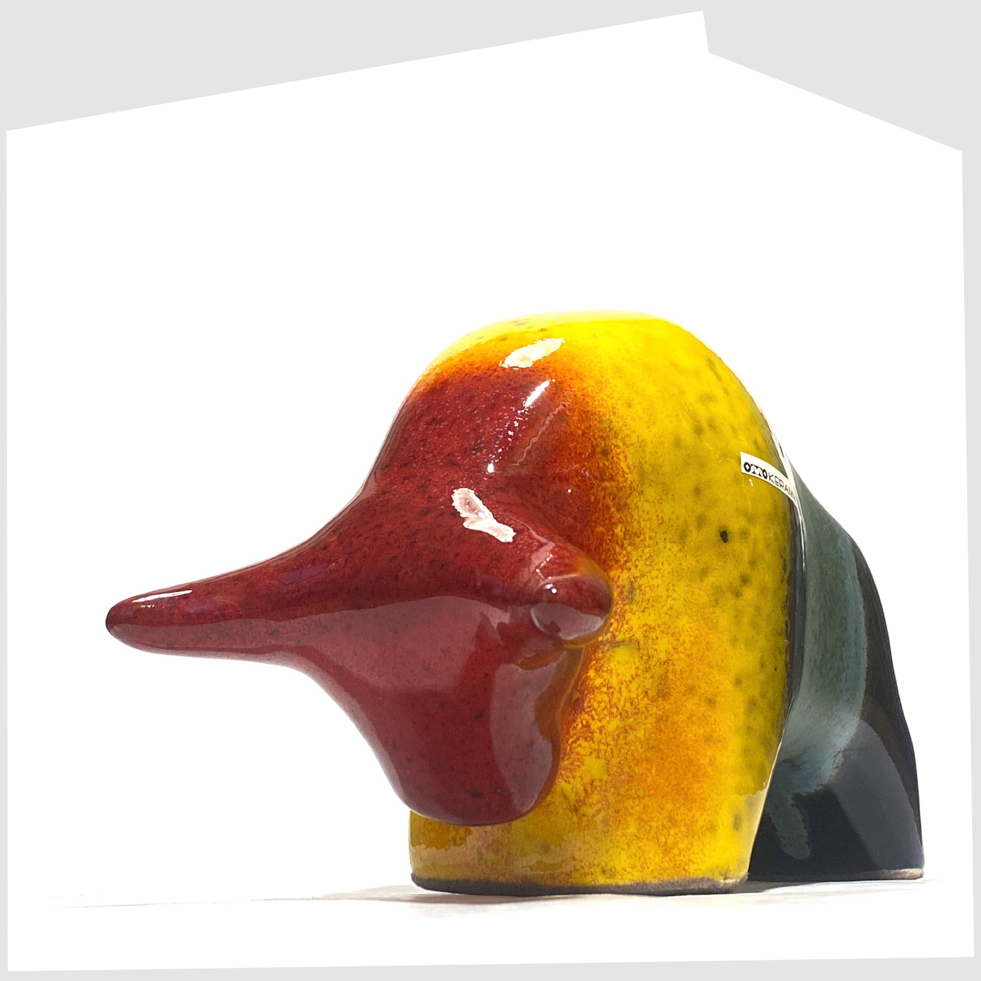 Front horns of the Otto Keramik ceramic bull in rainbow glaze of multicoloured stripes, shown on a white background