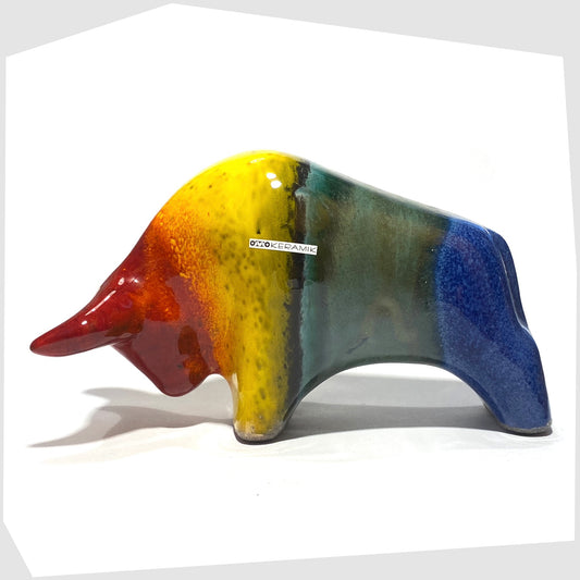 otto keramik ceramic bull sculpture in rainbow glaze of red, yellow, green and blue stripes
