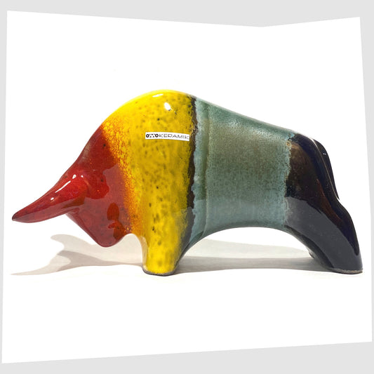 Otto Keramik ceramic bull in rainbow glaze of multicoloured stripes, shown on a white background