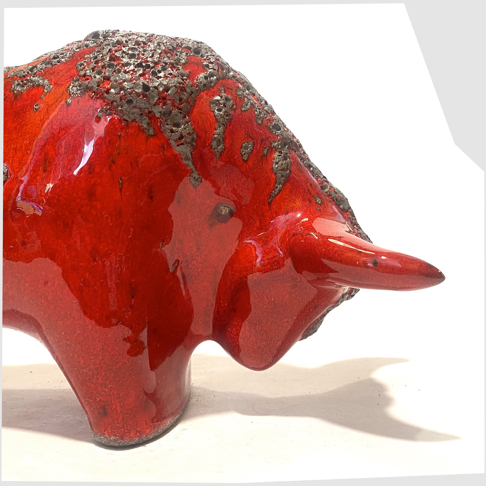 close up of the Otto Keramik Bull in Red Fat Lava Glaze