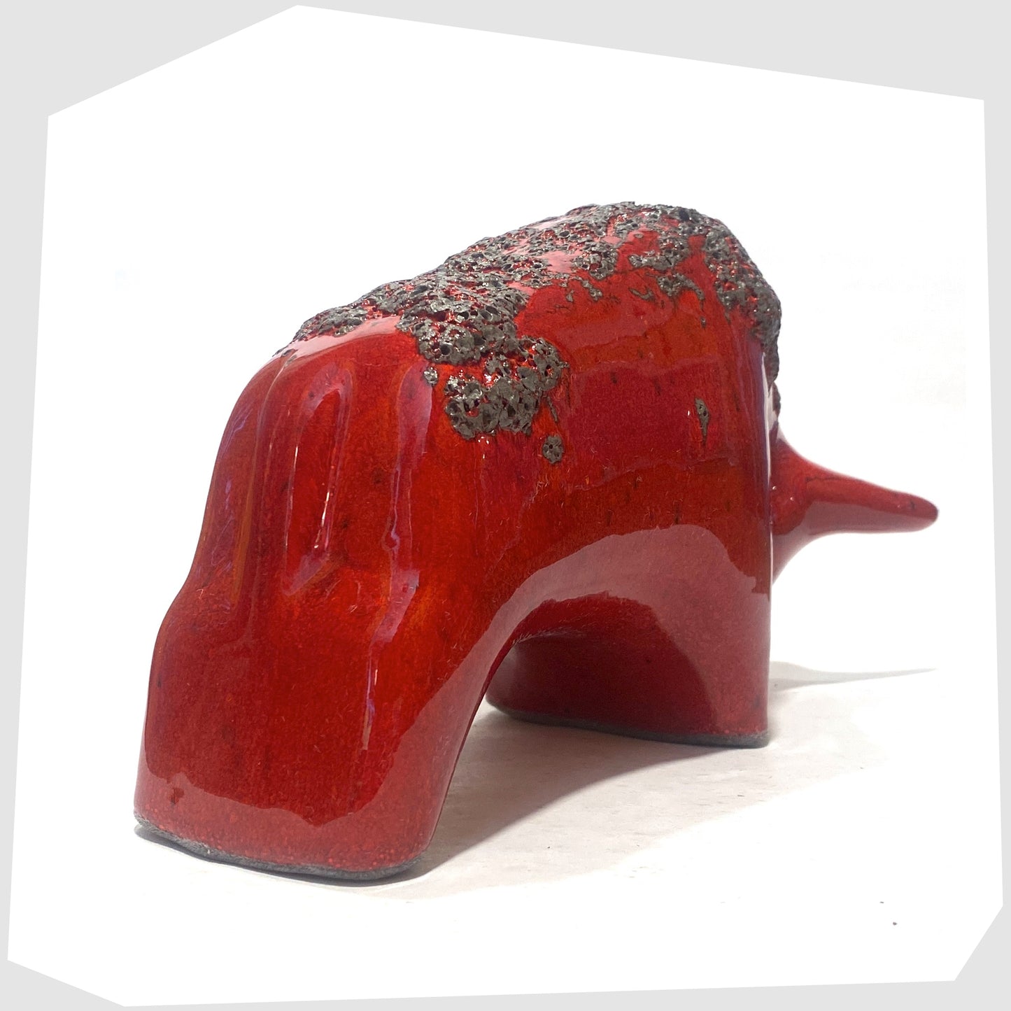 rear of the otto keramik ceramic bull in red glaze with grey fat lava along the spine
