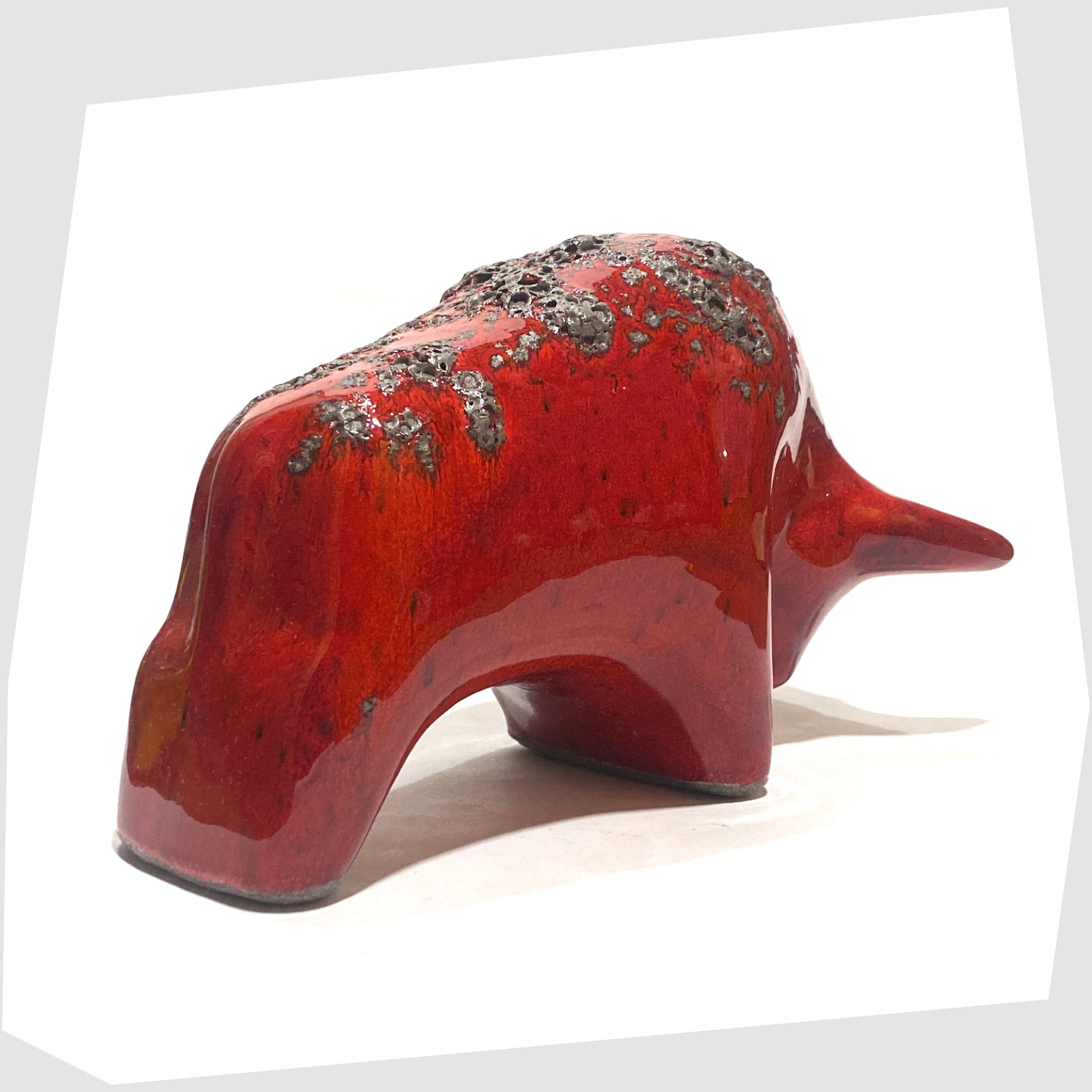 rear of the otto keramik ceramic bull in red glaze with grey fat lava along the spine