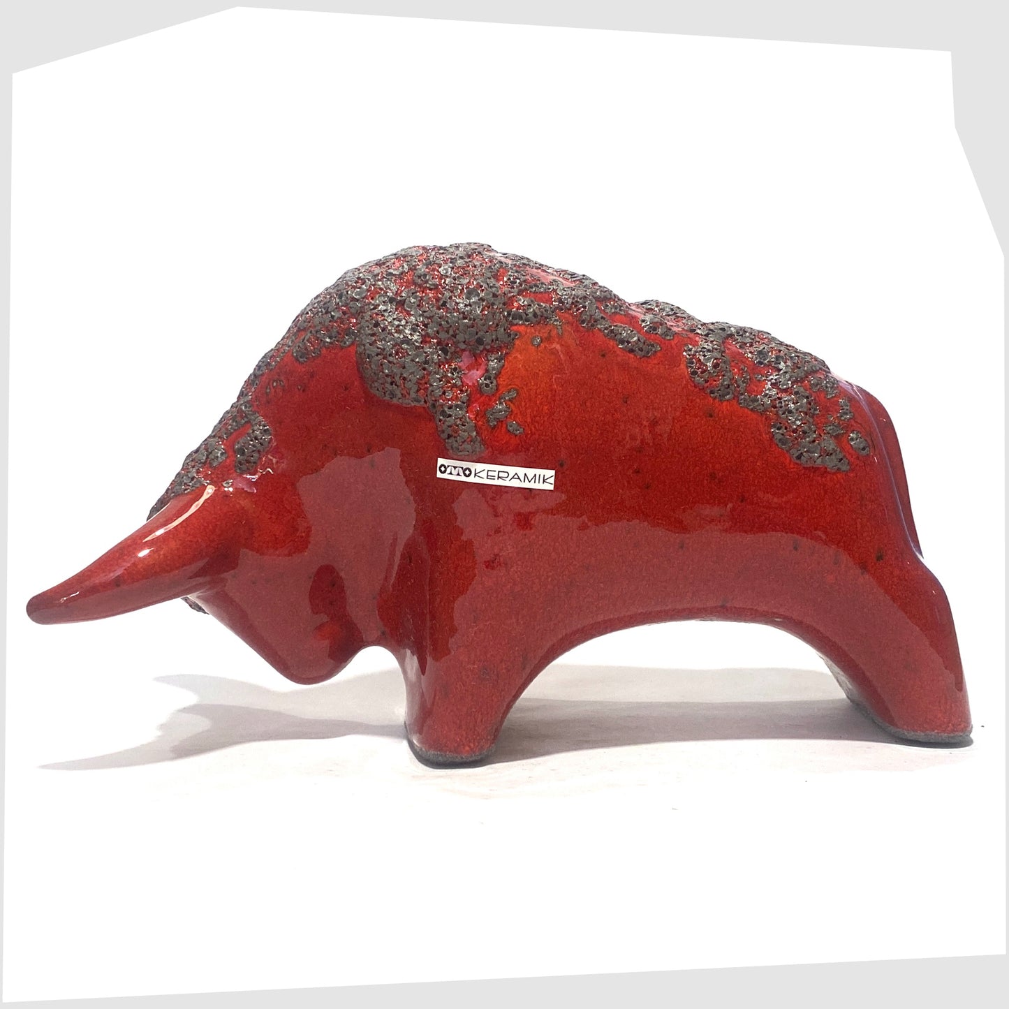 otto keramik ceramic bull in red glaze with grey fat lava along the spine