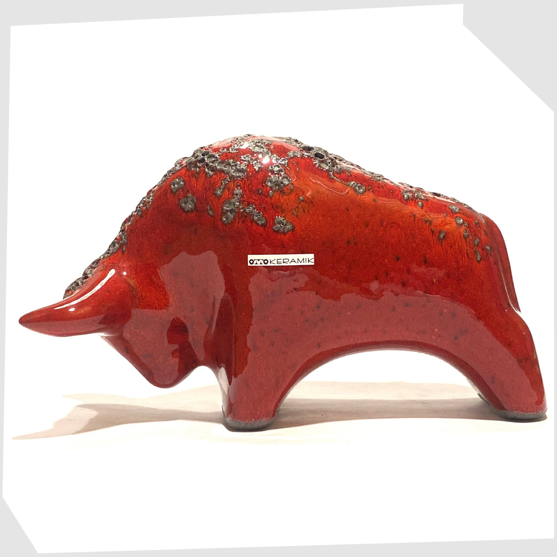 otto keramik ceramic bull in red glaze with grey fat lava along the spine