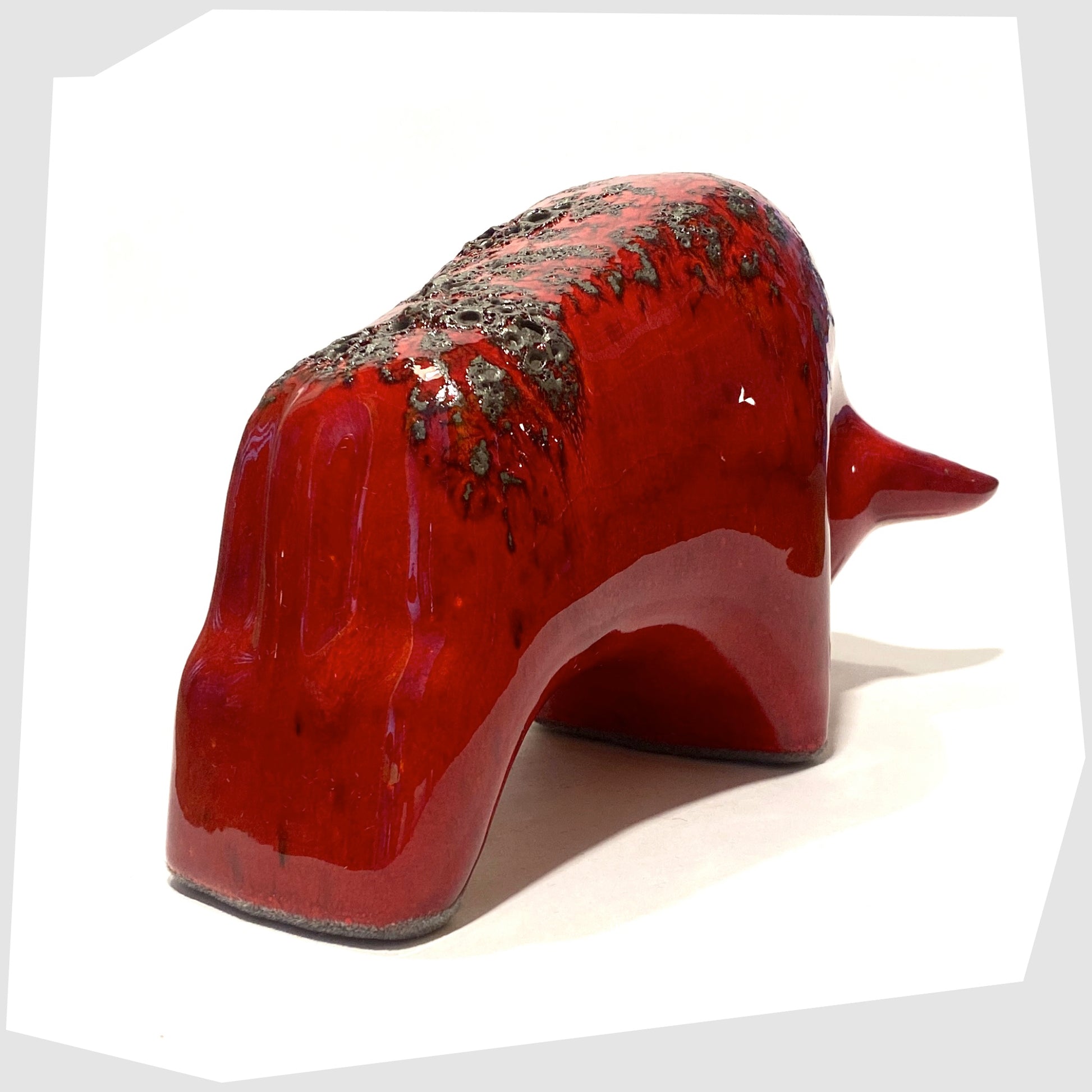 rear of the otto keramik ceramic bull in red glaze with grey fat lava along the spine