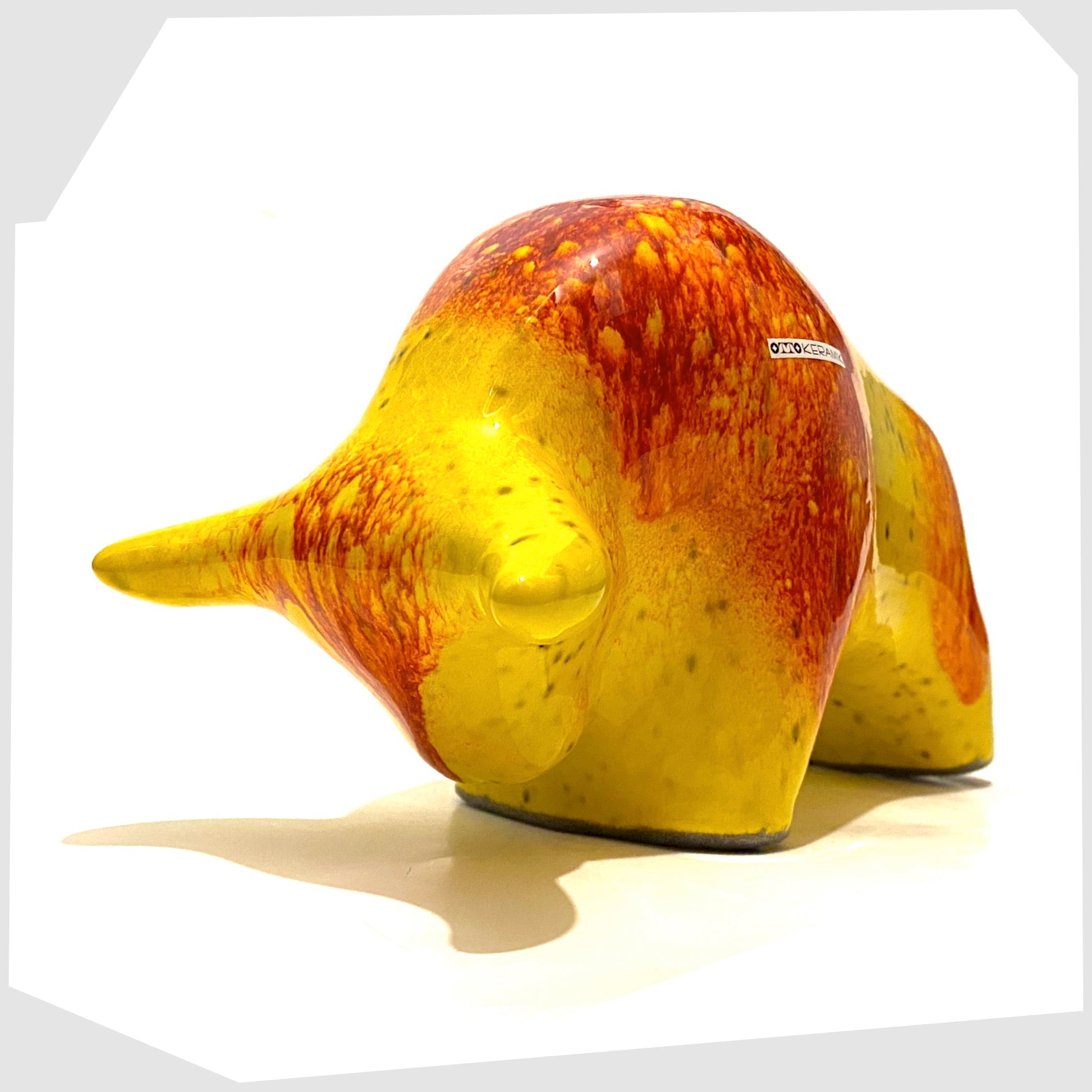 otto keramik ceramic bull ornament glazed in a vibrant yellow and orange colour way 