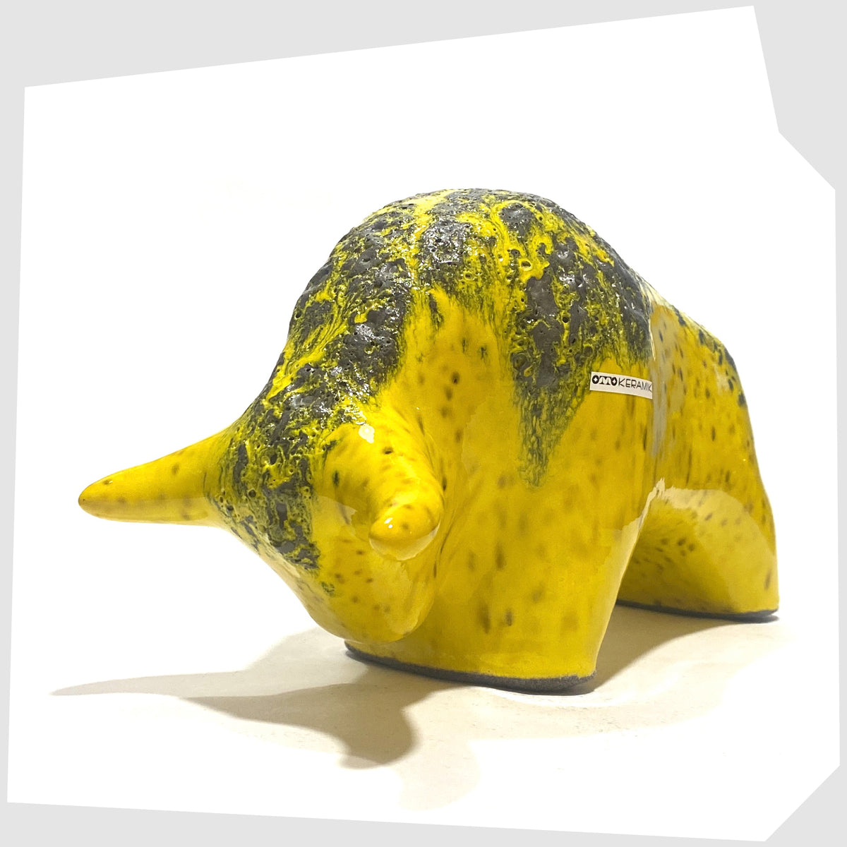 Front view of the Otto Keramik Ceramic Bull in yellow with grey fat lava on the spine, shown on a white background
