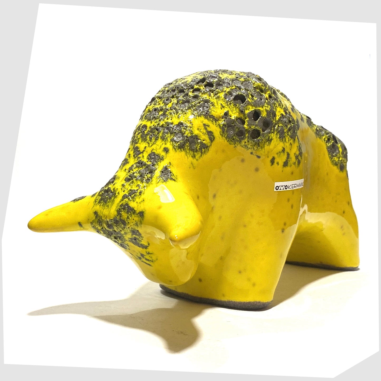 otto keramik ceramic bull in gloss yellow glazing with grey fat lava along the spine