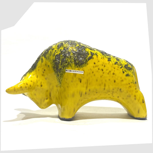 Otto Keramik Ceramic Bull in yellow with grey fat lava on the spine, shown on a white background