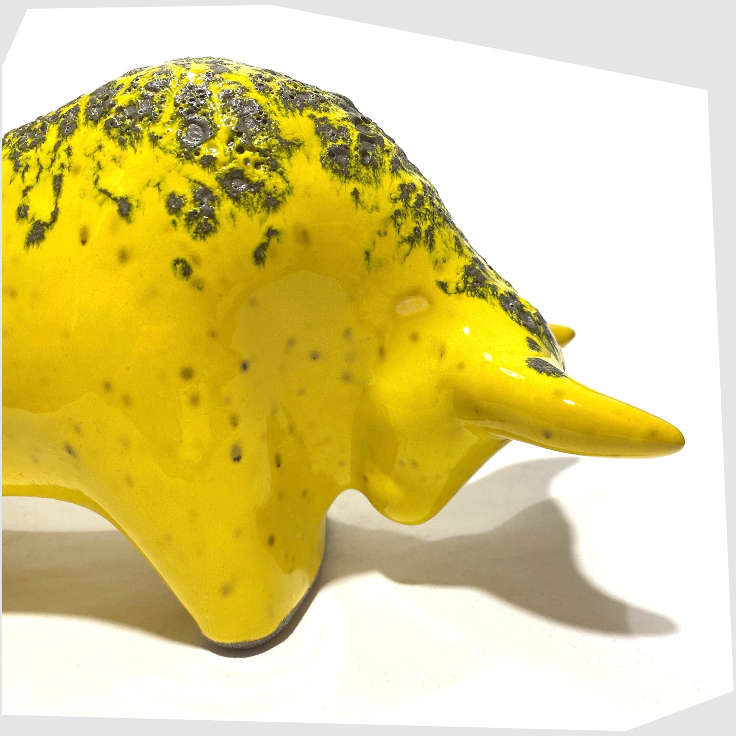close up of the yellow glazed ceramic bull ornament by otto keramik, germany