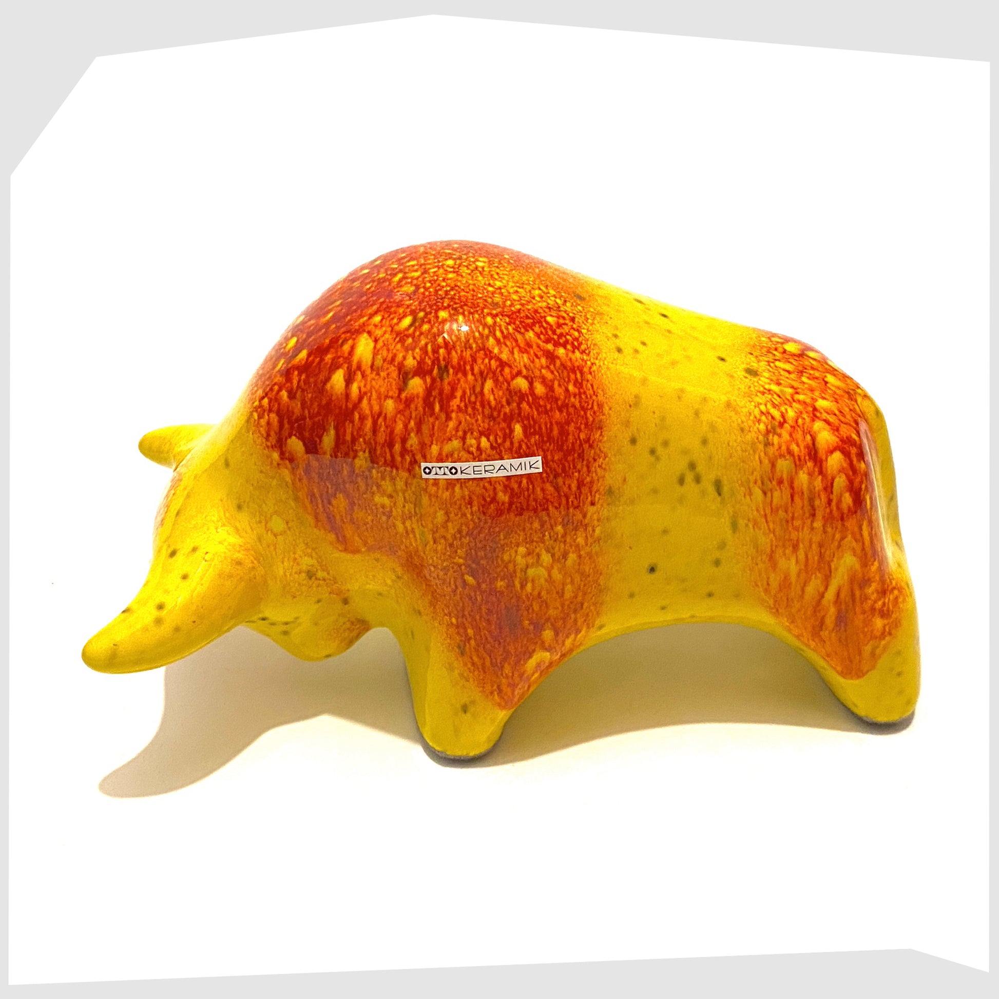 west german pottery style ceramic bull made by otto gerharz junior of otto keramiks, germany, glazed in a vibrant yellow and orange striped glaze