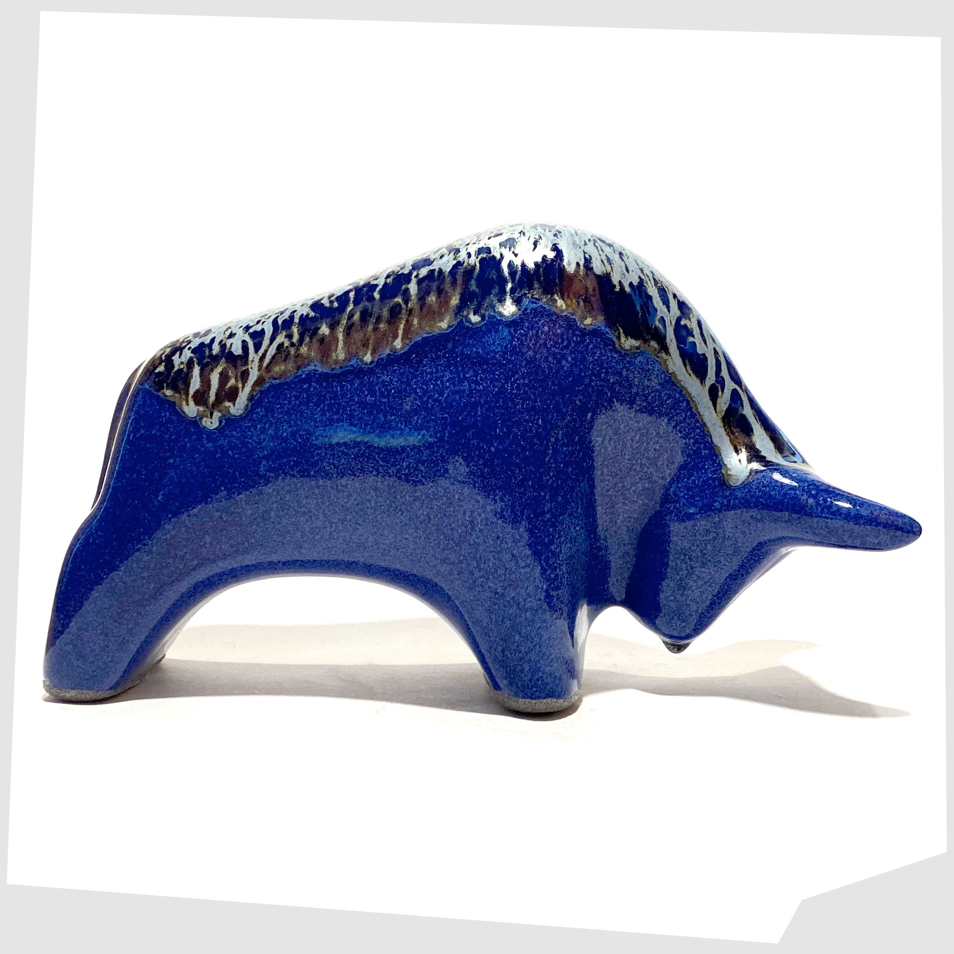 otto keramik bull in a dark blue metallic glaze with silver bambas glazing along the spine