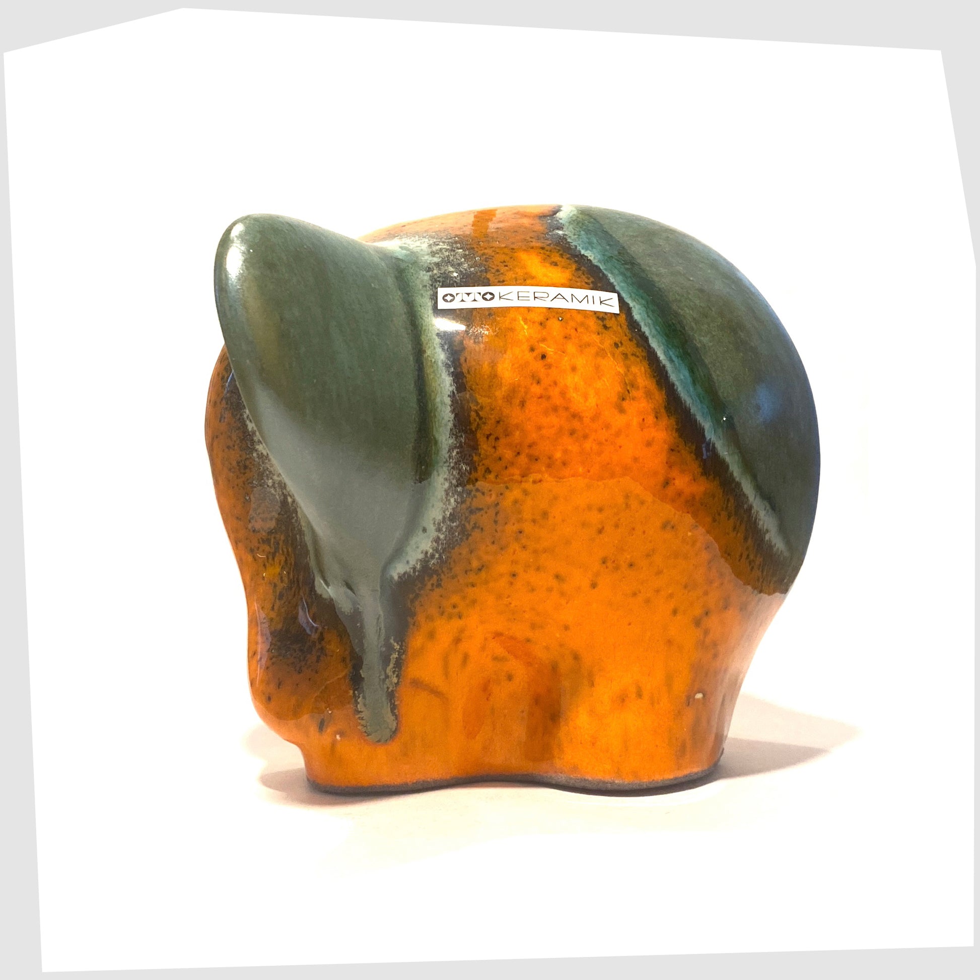 otto keramik elephant in peru glaze of orange with sea green strips