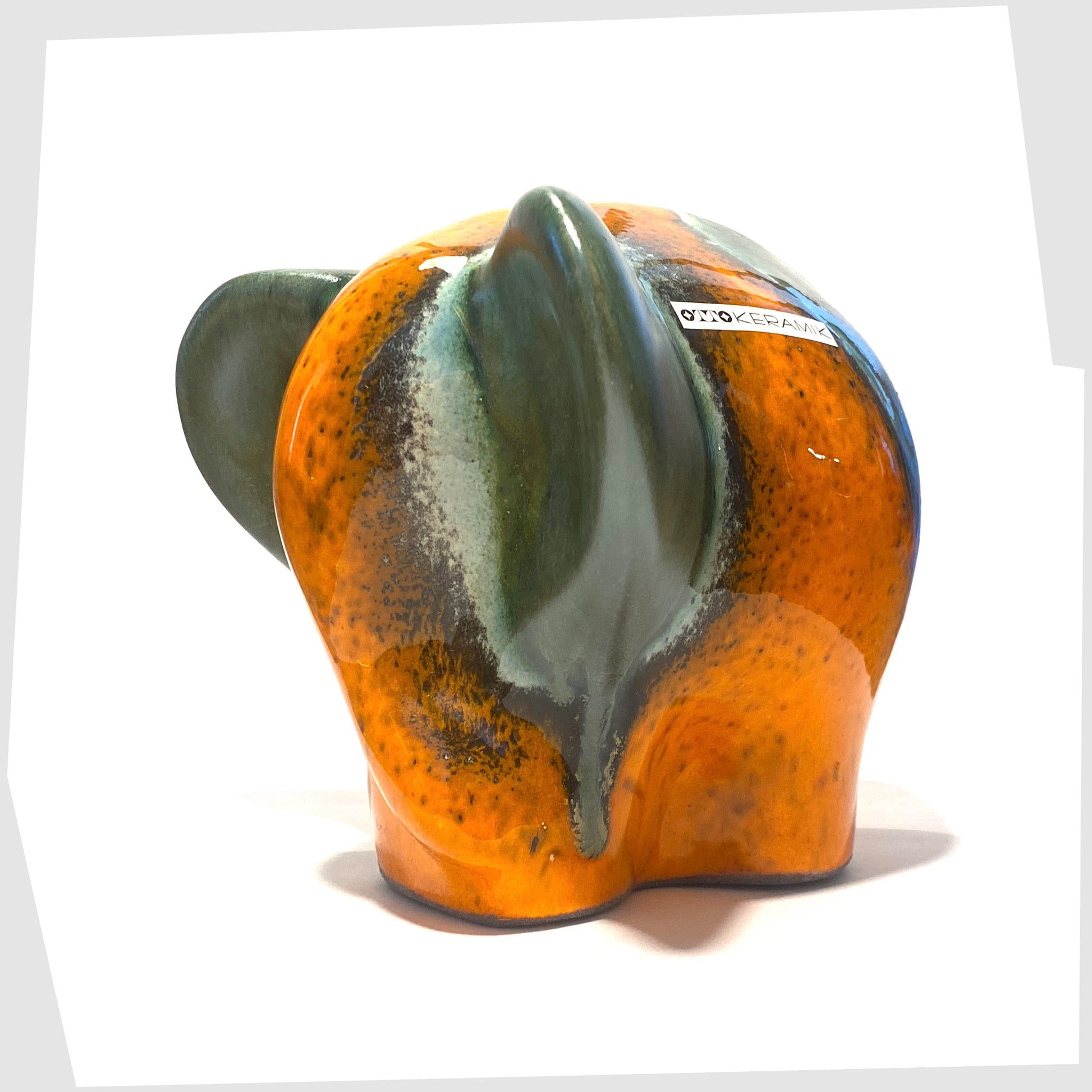 otto keramik ceramic elephant in peru glaze of vibrant orange with sea green stripes