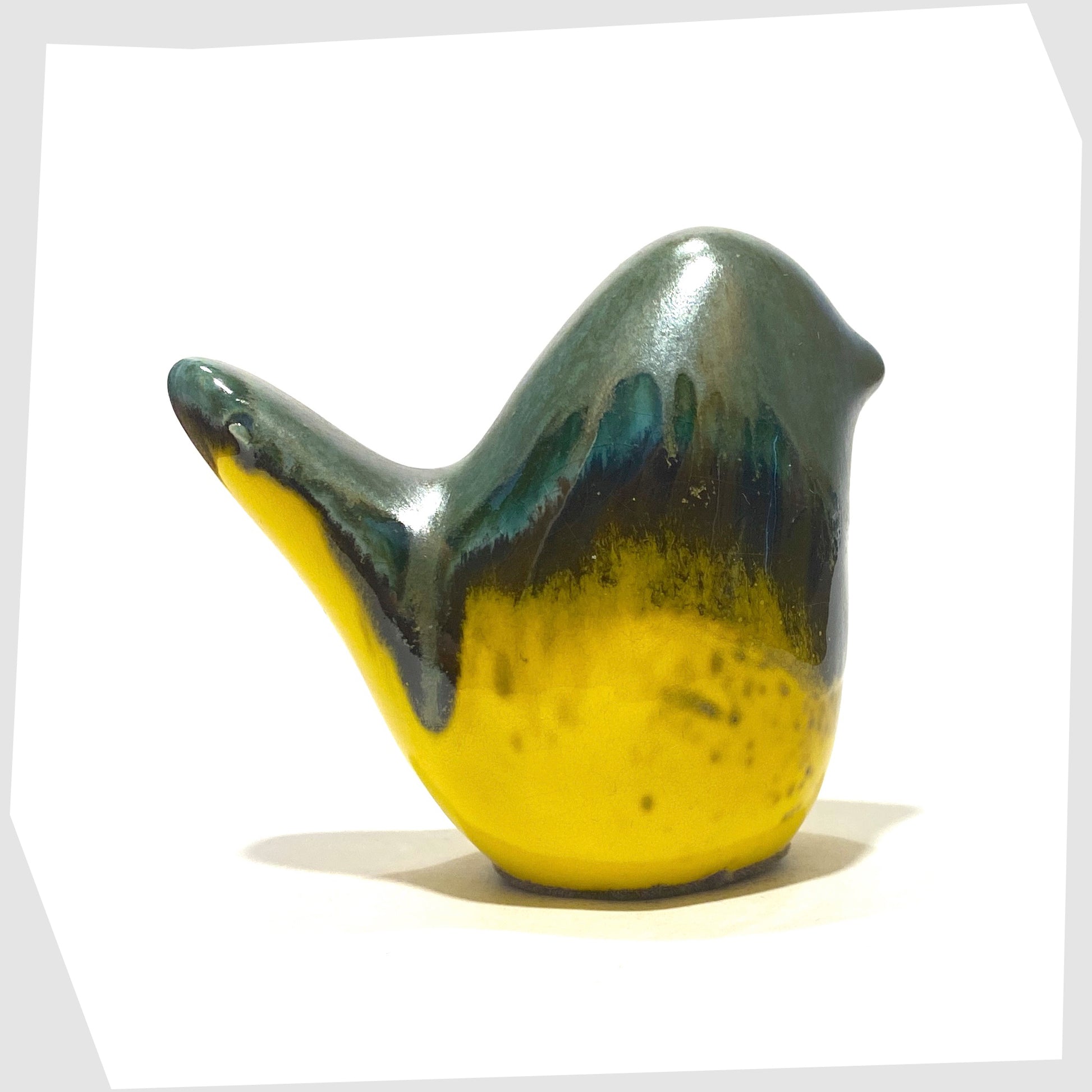 ceramic bird in sea green drip glaze over a gloss yellow base, made by otto keramik, Germany