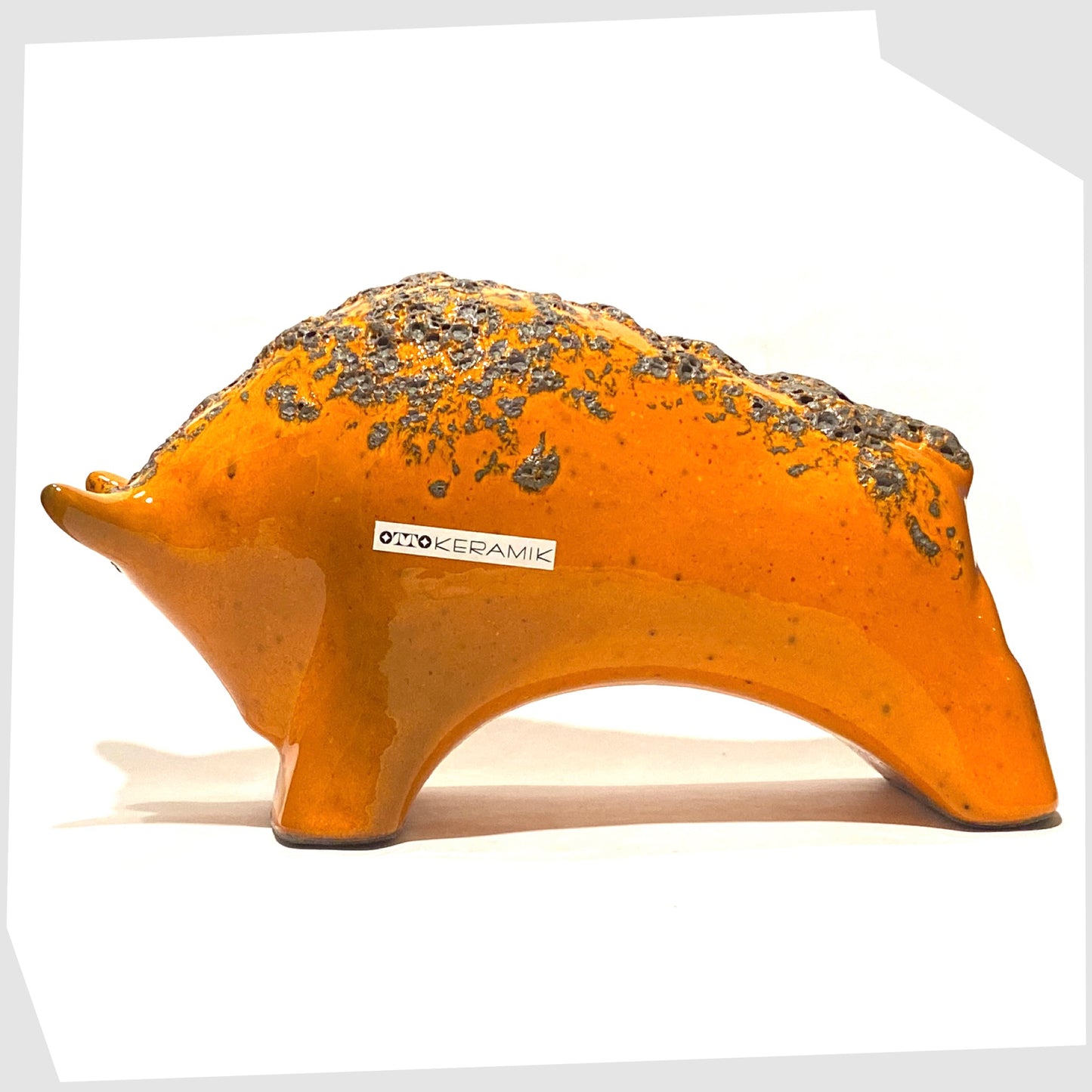 large otto keramik bull in vivid orange with fat lava stripe on the rear