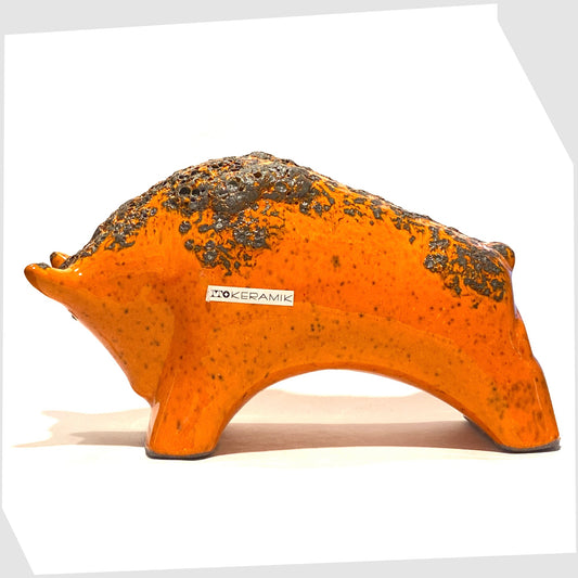 large otto keramik bull in vivid orange with fat lava stripe on the rear