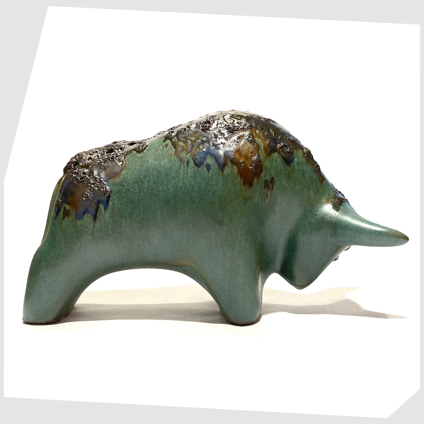 otto keramik ceramic bull sculpture glazed in sea green with black fat lava along the spine