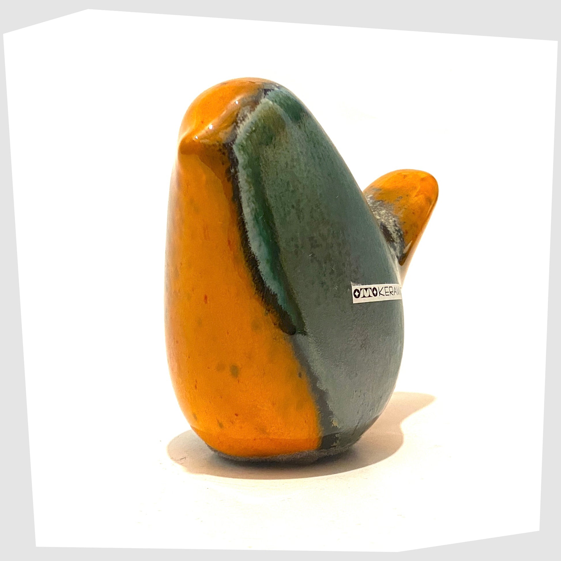 otto-keramik-pottery-bird-ornament-in-orange-and-sea-green-peru-glaze