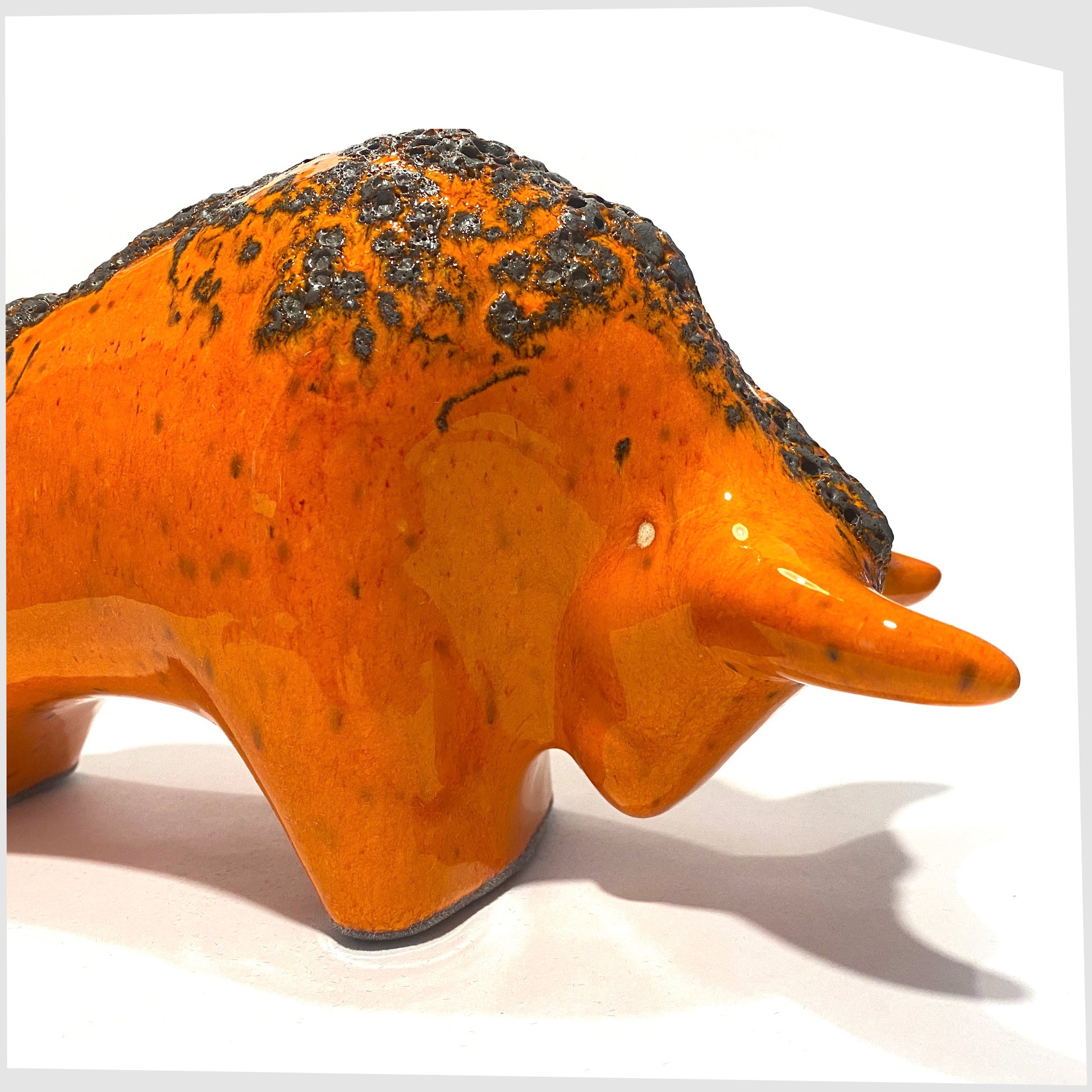 otto keramik ceramic bull sculpture in vibrant orange with fat lava along the spine