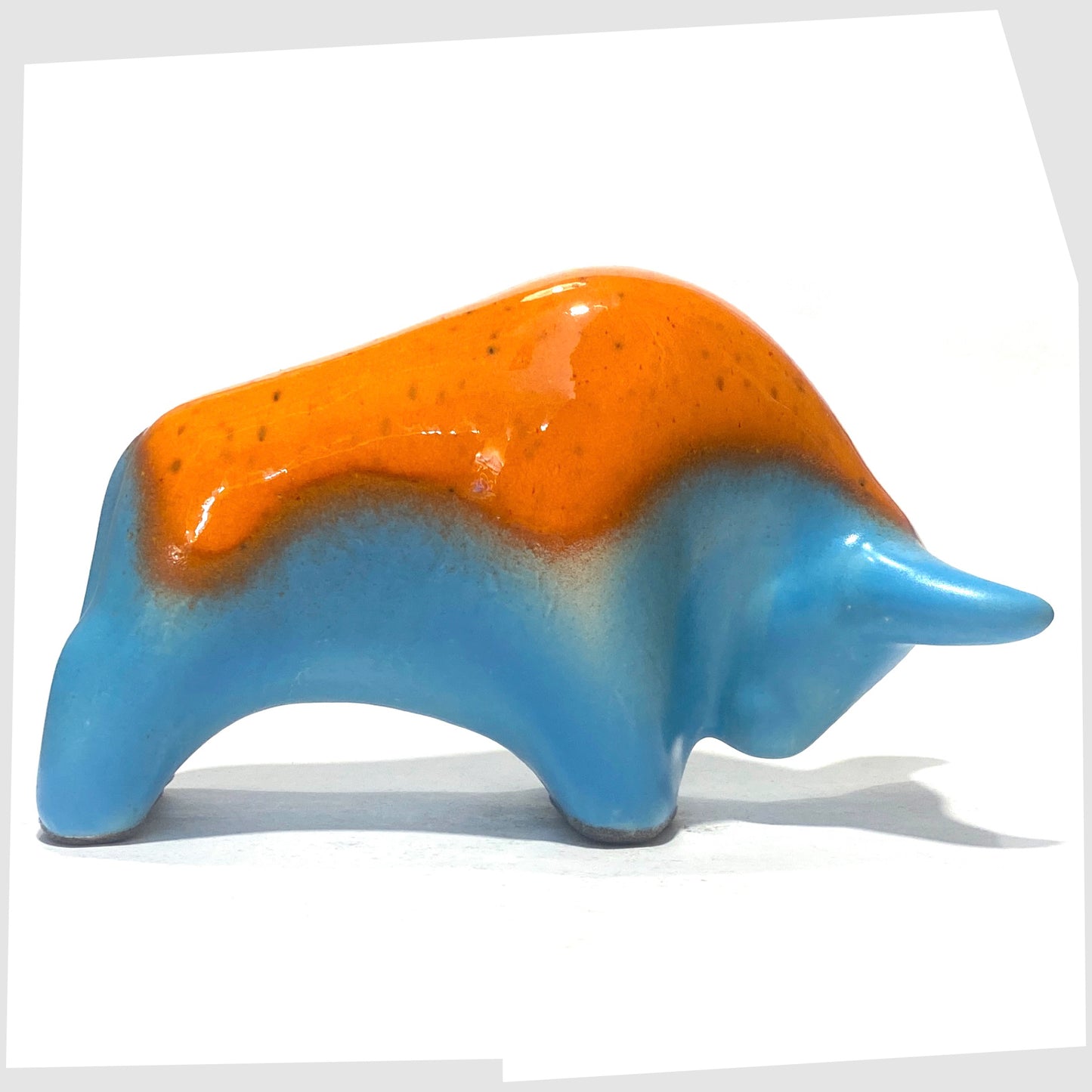 orange over light blue ceramic bull made by otto keramik, germany
