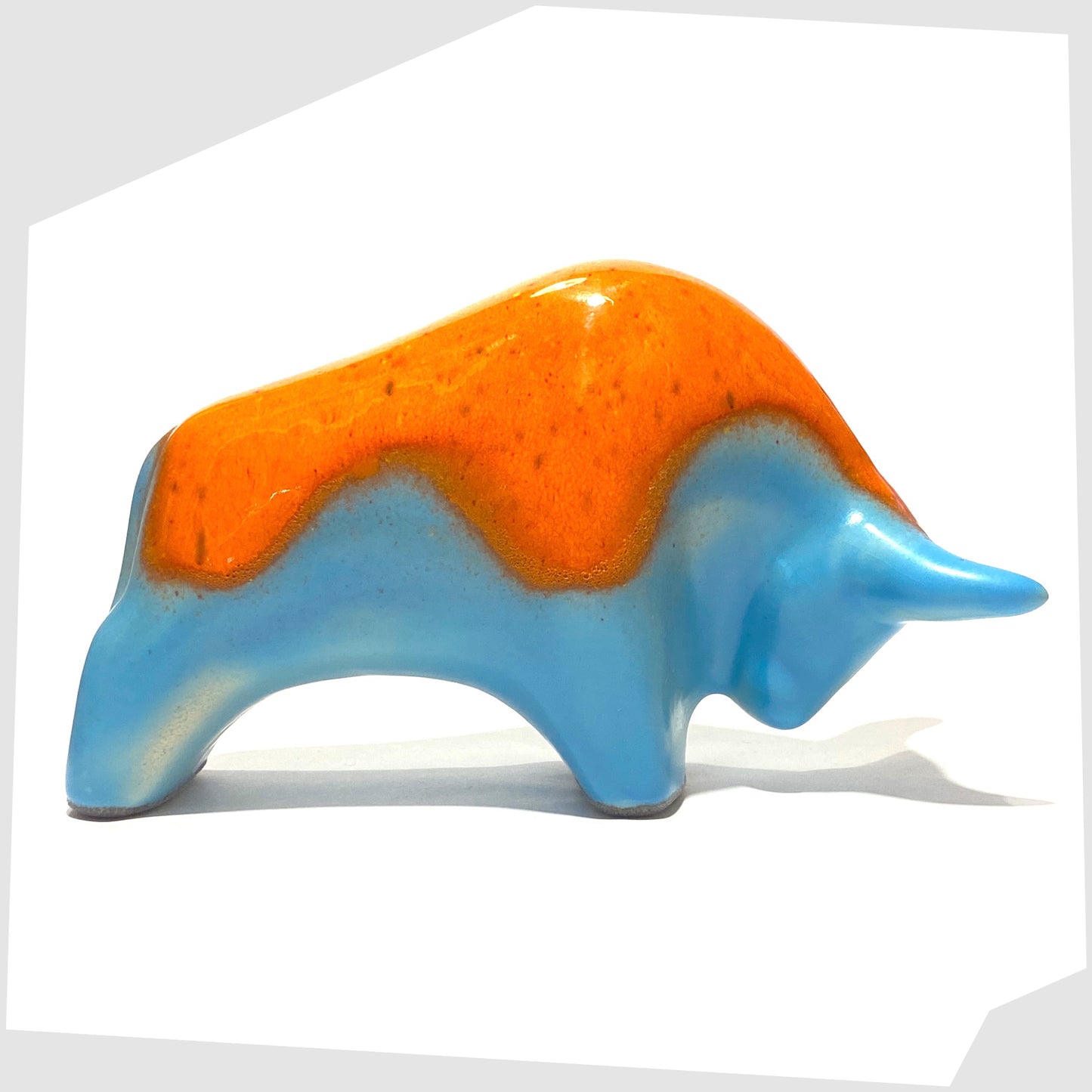 orange over light blue ceramic bull made by otto keramik, germany