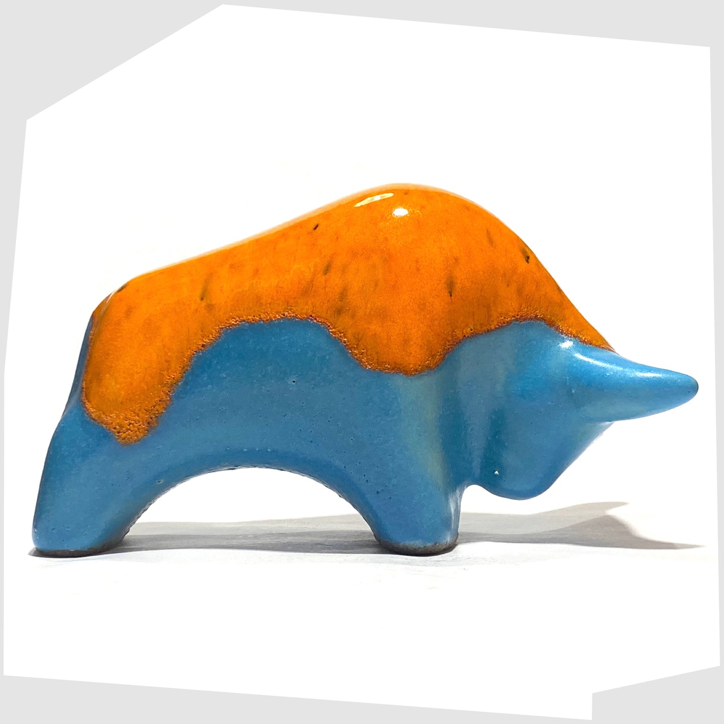 Otto Keramik Ceramic Bull in Orange Over Blue drip glaze, shown on a white background