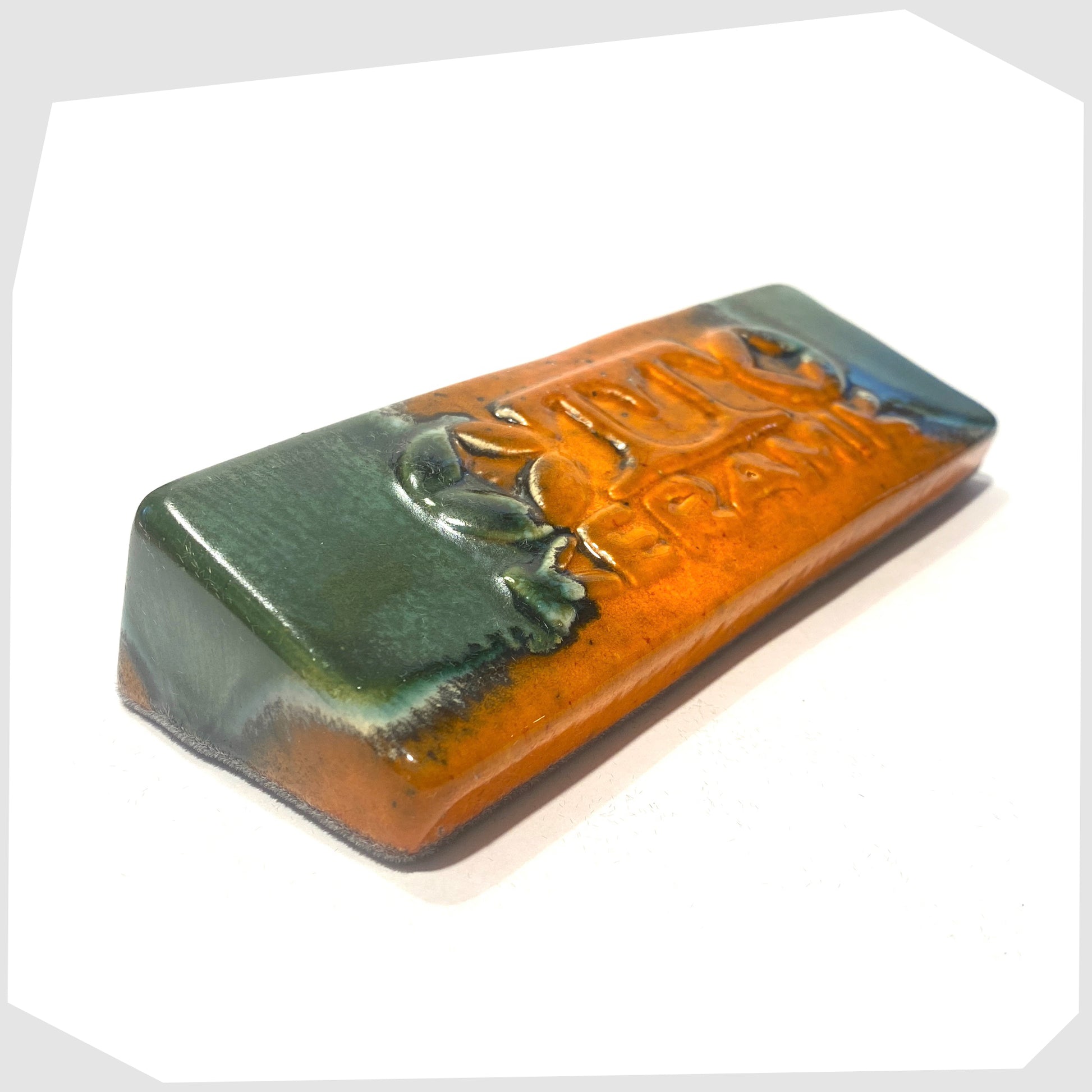 otto keramik display tile, glazed in the peru glaze of orange and sea green stripes