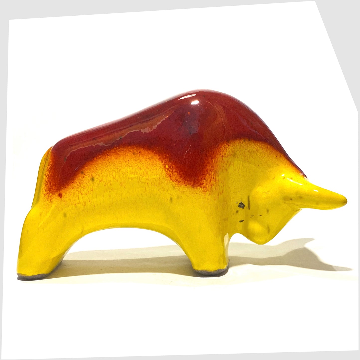 otto keramik bull in rich red over vibrant yellow glaze