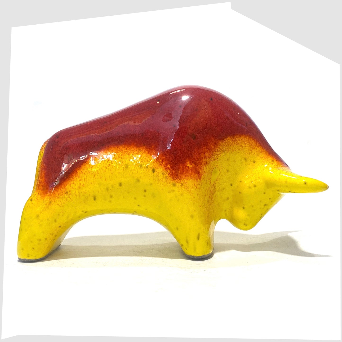 otto keramik bull in rich red over vibrant yellow glaze