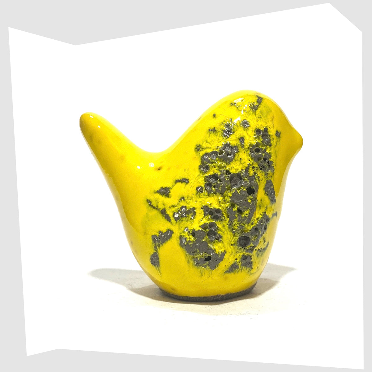 Otto Keramik Ceramic Bird in yellow glaze with grey fat lava, shown on a white background
