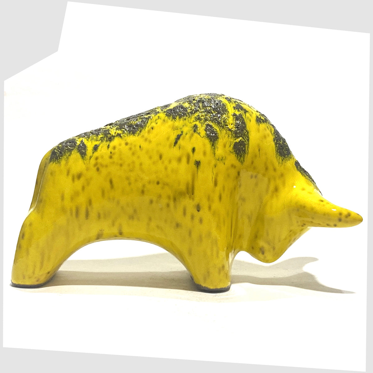 Otto Keramik Bull in yellow with grey fat lava on the spine, shown on a white background