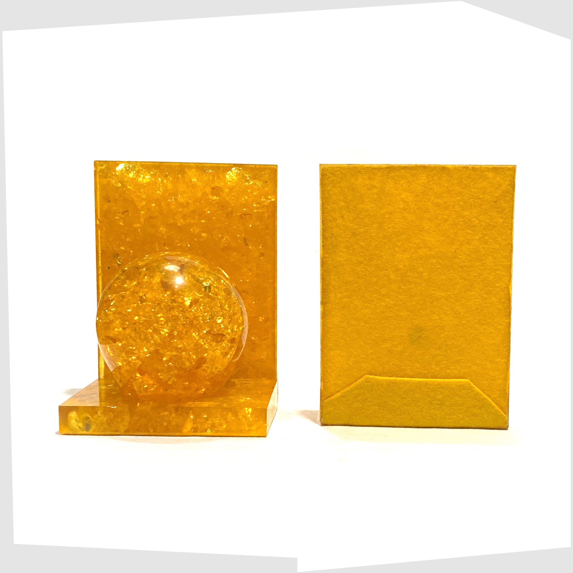 front and rear of the vintage Shattaline Bookend in orange resin